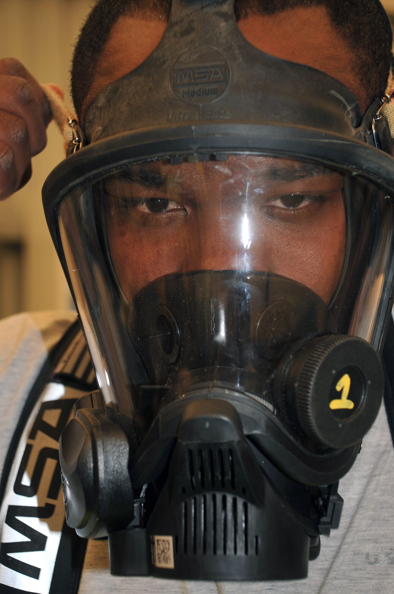 Staff Sgt. Sterling McClendon, bioenvironmental engineering journeyman with the 380th Expeditionary Medical Group bioenvironmental engineering section, participates in a co-agency training exercise with the 380th Expeditionary Civil Engineer Squadron emergency management flight April 9, 2010, at a non-disclosed base in Southwest Asia. The exercise helped maintain readiness and cooperation between agencies for events such as a hazardous material response. Sergeant McClendon is deployed from the 81st Medical Group at Keesler Air Force Base, Miss., and his hometown is El Paso, Texas. (U.S. Air Force Photo/Master Sgt. Scott T. Sturkol/Released)