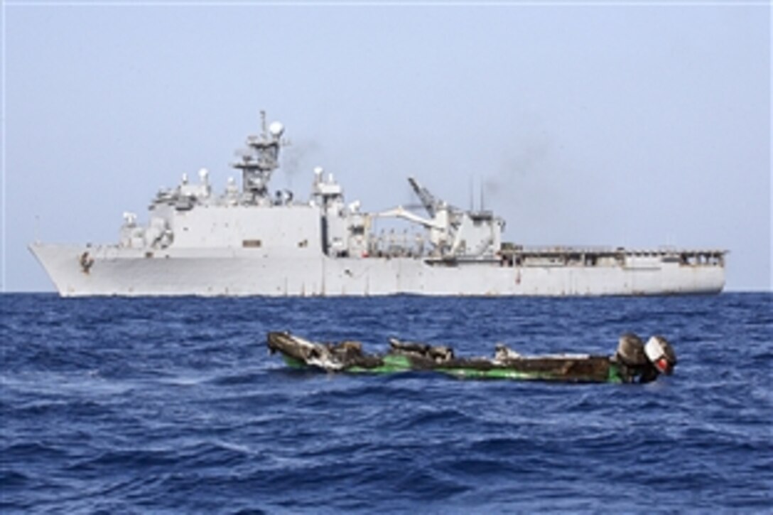 A skiff used by suspected pirates drifts after the amphibious dock landing ship USS Ashland destroyed it at sea, April 10, 2010. The Ashland is part of the Nassau Amphibious Ready Group and 24th Marine Expeditionary Unit, currently supporting maritime operations in the U.S. 5th Fleet area of operations.