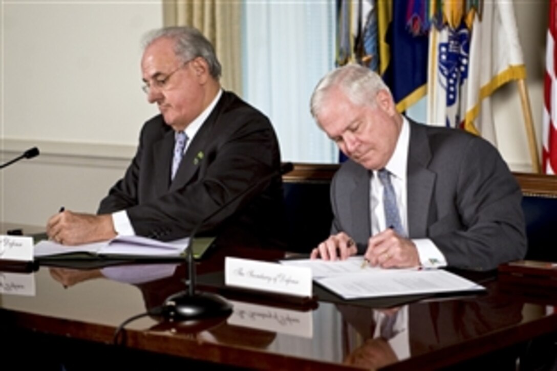 U.S. Defense Secretary Robert M. Gates and Brazilian Defense Minister Nelson Jobim sign a U.S. and Brazil Cooperation Agreement at the Pentagon, April 12, 2010.
