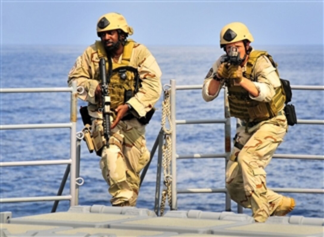 Members of a visit, board, search and seizure team from the littoral combat ship USS Freedom (LCS 1) conduct tactical exercises aboard the guided-missile cruiser USS Bunker Hill (CG 52) while underway in the Pacific Ocean on April 7, 2010.  The Freedom and the Bunker Hill are supporting Southern Seas 2010, a U.S. Southern Command-directed operation that provides U.S. and international forces the opportunity to operate in a multinational environment.  