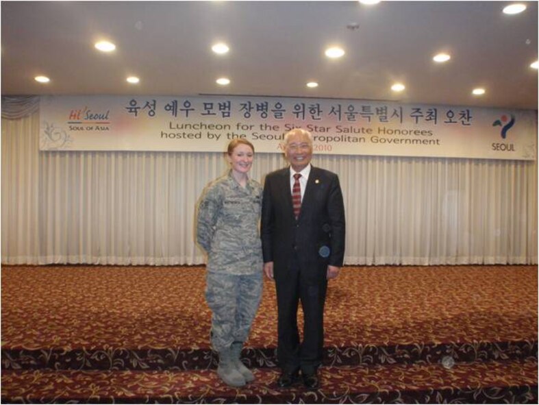 Senior Airman Chelsea Whitworth, 607th Air Operations Center target development analyst, poses with the Washington State Senator Paul Shin who is a guest speaker at the 39th annual USO Six Star Salute gala dinner. (U.S. Air Force photo)  