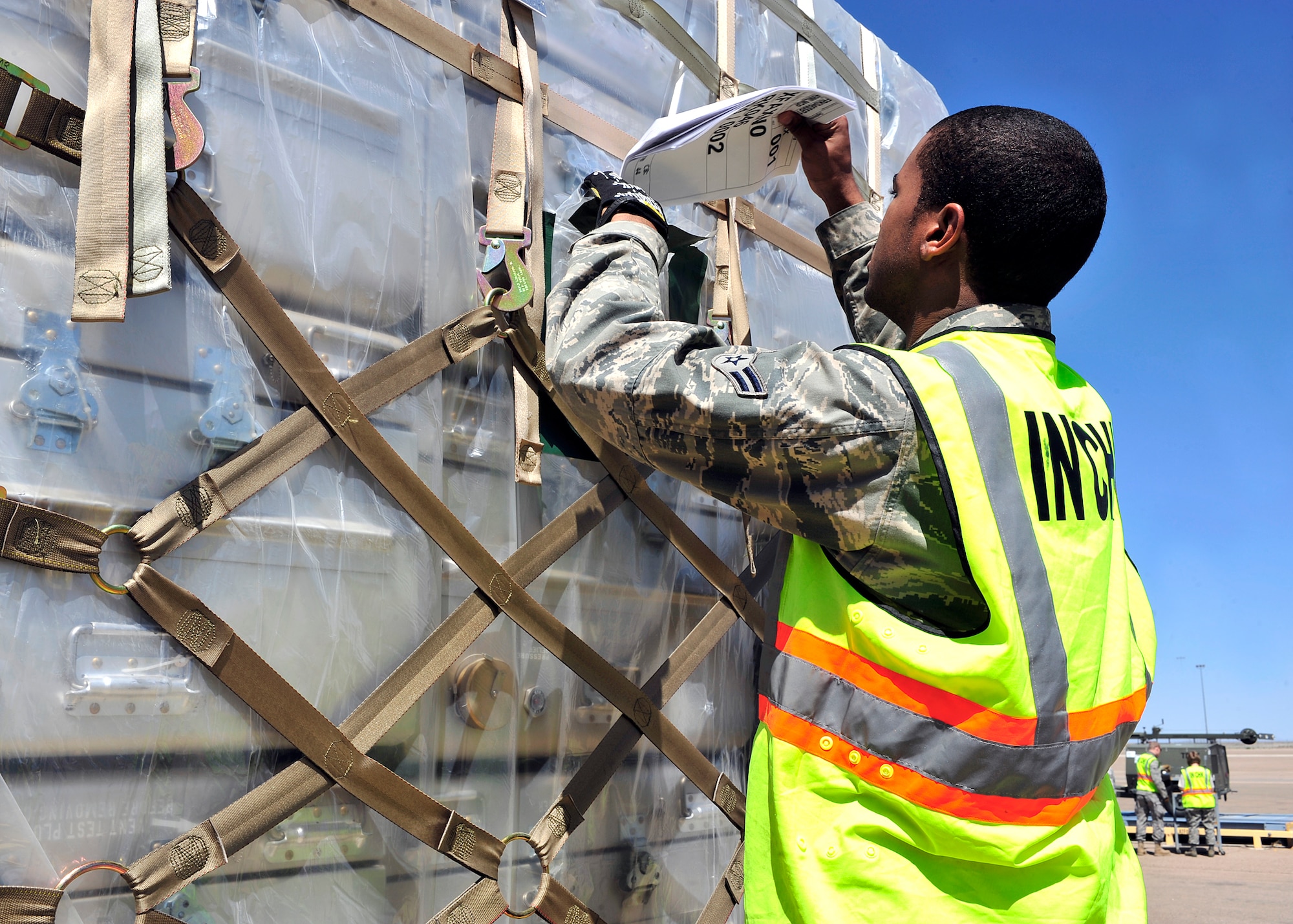HOLLOMAN AIR FORCE BASE, N.M. -- Members of the 49th Materiel Maintenance Group prepare cargo April 13, 2010, for a simulated deployment at Basic Expeditionary Airfield Resources Base, in support of an operational readiness exercise. The purpose of the ORE is to prepare members of Team Holloman for deployments and ensure that they are well-trained and prepared to deploy at a moments notice. (U.S. Air Force photo by Senior Airman DeAndre Curtiss)