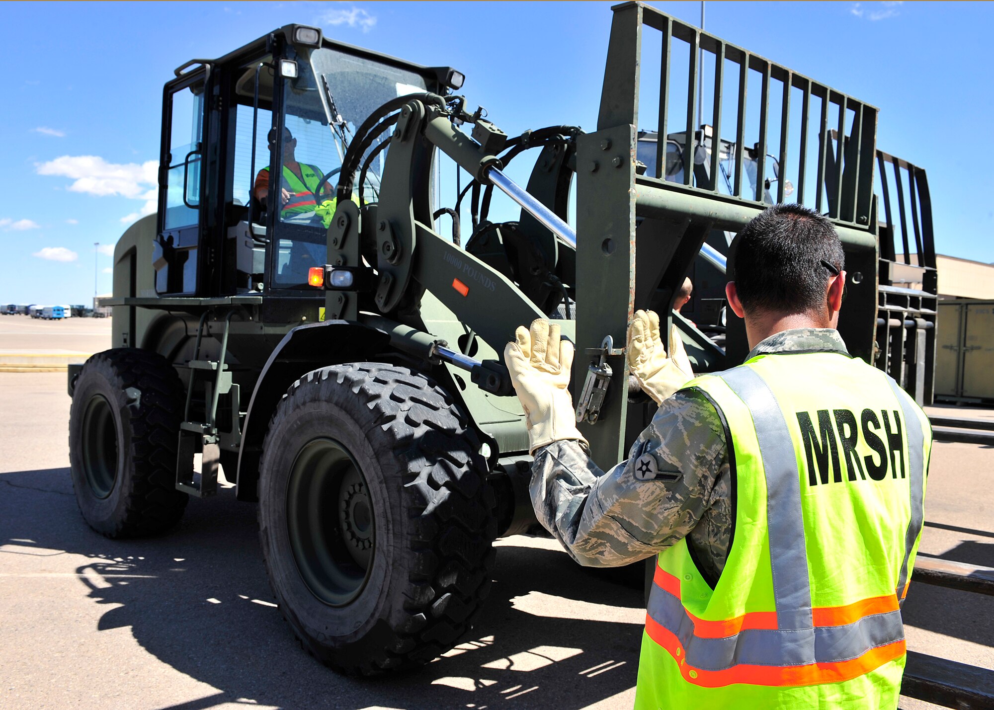 HOLLOMAN AIR FORCE BASE, N.M. -- Members of the 49th Materiel Maintenance Group prepare cargo April 13, 2010, for a simulated deployment at Basic Expeditionary Airfield Resources Base, in support of an operational readiness exercise. The 49th Materiel Maintenance Group is responsible for the storage, inspection, repair, deployment and accountability of bare base assets belonging to Air Combat Command. (U.S. Air Force photo by Senior Airman DeAndre Curtiss) 