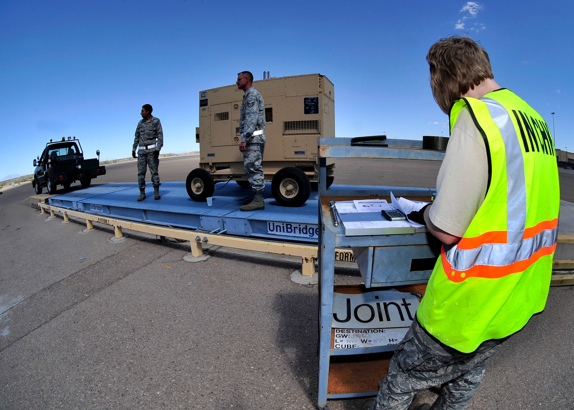 HOLLOMAN AIR FORCE BASE, N.M. -- Members of the 49th Materiel Maintenance Group prepare cargo April 13, 2010, for a simulated deployment at Basic Expeditionary Airfield Resources Base, in support of an operational readiness exercise. The purpose of the ORE is to prepare members of Team Holloman for deployments and ensure that they are well-trained and prepared to deploy at a moments notice. (U.S. Air Force photo by Senior Airman DeAndre Curtiss)
