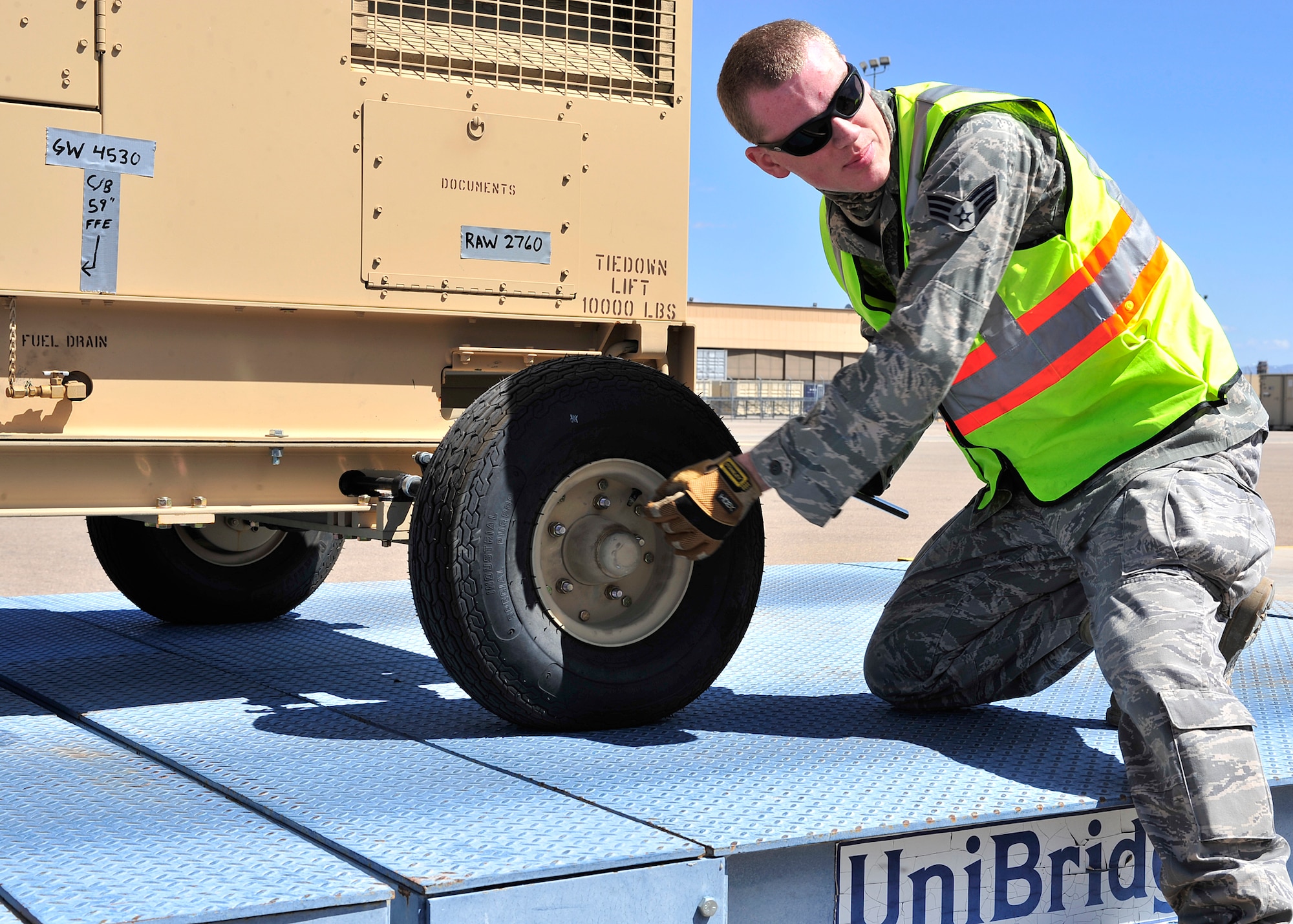 HOLLOMAN AIR FORCE BASE, N.M. -- Members of the 49th Materiel Maintenance Group prepare cargo April 13, 2010, for a simulated deployment at Basic Expeditionary Airfield Resources Base, in support of an operational readiness exercise. The 49th Materiel Maintenance Group is responsible for the storage, inspection, repair, deployment and accountability of bare base assets belonging to Air Combat Command. (U.S. Air Force photo by Senior Airman DeAndre Curtiss) 
