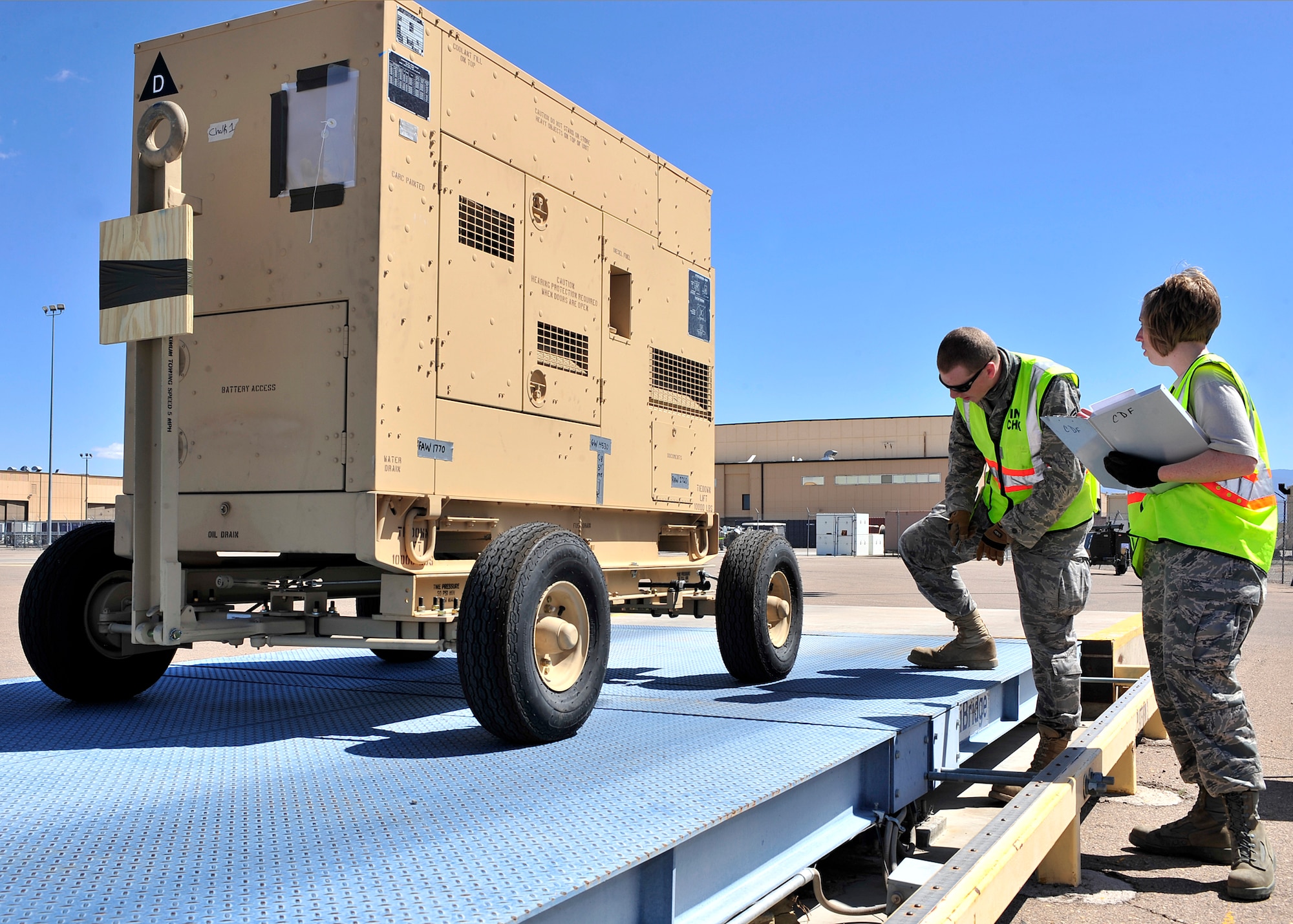 HOLLOMAN AIR FORCE BASE, N.M. -- Members of the 49th Materiel Maintenance Group prepare cargo April 13, 2010, for a simulated deployment at Basic Expeditionary Airfield Resources Base, in support of an operational readiness exercise. The purpose of the ORE is to prepare members of Team Holloman for deployments and ensure that they are well-trained and prepared to deploy at a moments notice. (U.S. Air Force photo by Senior Airman DeAndre Curtiss)