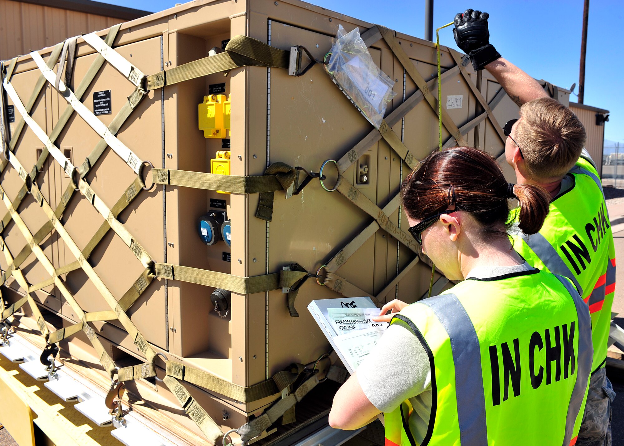 HOLLOMAN AIR FORCE BASE, N.M. -- Members of the 49th Materiel Maintenance Group prepare cargo April 13, 2010, for a simulated deployment at Basic Expeditionary Airfield Resources Base, in support of an operational readiness exercise. The 49th Materiel Maintenance Group is responsible for the storage, inspection, repair, deployment and accountability of bare base assets belonging to Air Combat Command. (U.S. Air Force photo by Senior Airman DeAndre Curtiss) 