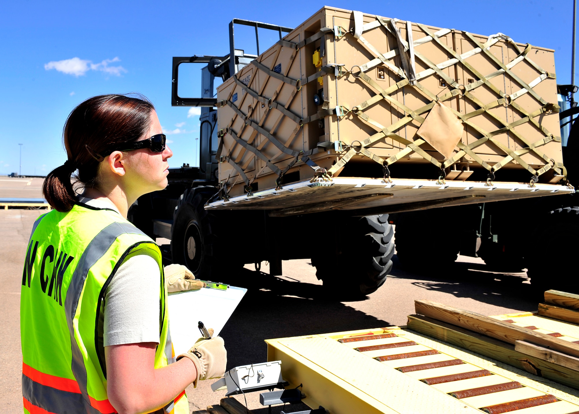 HOLLOMAN AIR FORCE BASE, N.M. -- Members of the 49th Materiel Maintenance Group prepare cargo April 13, 2010, for a simulated deployment at Basic Expeditionary Airfield Resources Base, in support of an operational readiness exercise. The purpose of the ORE is to prepare members of Team Holloman for deployments and ensure that they are well-trained and prepared to deploy at a moments notice. (U.S. Air Force photo by Senior Airman DeAndre Curtiss) 