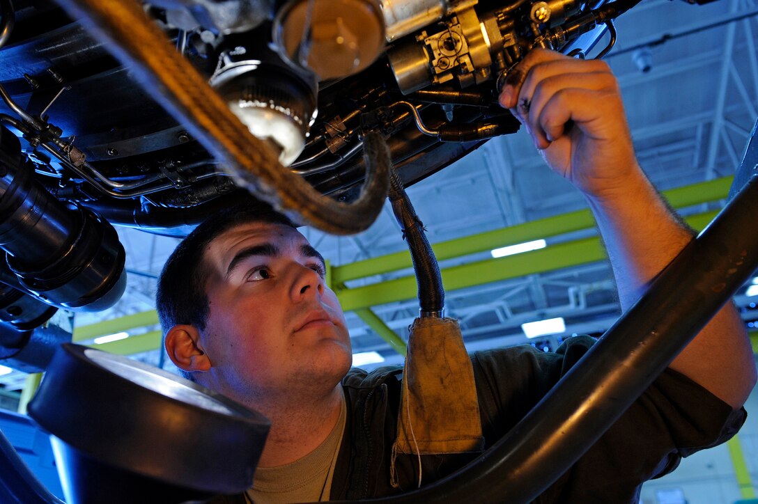 ELLSWORTH AIR FORCE BASE, S.D. - Airmen 1st Class Adam Reinert, 28th Maintenance Squadron aerospace propulsion apprentice, inspects a B-1B Lancer engine for possible broken safety wires and missing parts, April 9.  The 28 MXS services 29 B-1s from two bomb squadrons. (U.S. Air Force photo/Senior Airman Marc I. Lane)