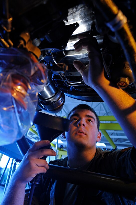 ELLSWORTH AIR FORCE BASE, S.D. - Airmen 1st Class Adam Reinert, 28th Maintenance Squadron aerospace propulsion apprentice, inspects a B-1B Lancer engine for broken safety wires and missing parts, April 9.  The B-1 engines are inspected after every 100 hours of flying. (U.S. Air Force photo/Senior Airman Marc I. Lane)
