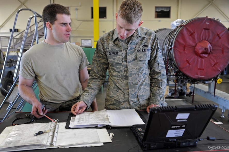 ELLSWORTH AIR FORCE BASE, S.D. - (Left) Airmen 1st Class Benjamen Lundy and Robert Cadreau verify the progress of maintenance of a B-1B Lancer engine, April 9.  Airmen Lundy and Cadreau are both aerospace propulsion technicians assigned to the 28th Maintenance Squadron. (U.S. Air Force photo/Senior Airman Marc I. Lane)