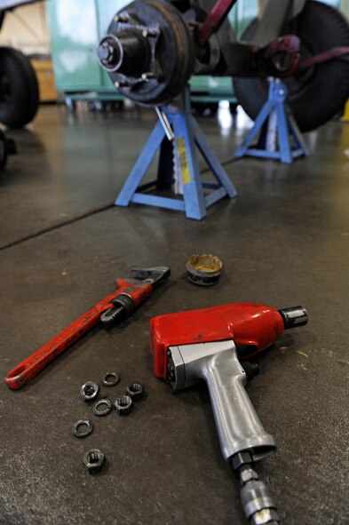 ELLSWORTH AIR FORCE BASE, S.D. - Members of the 28th Maintenance Squadron use a variety of tools during their daily duties, such as an impact ratchet wrench, and adjustable wrench which are essential in various stages of maintenance on B-1B Lancer engine trailers, April 9.  The 28 MXS services 29 B-1s from two bomb squadrons. (U.S. Air Force photo/Senior Airman Marc I. Lane)