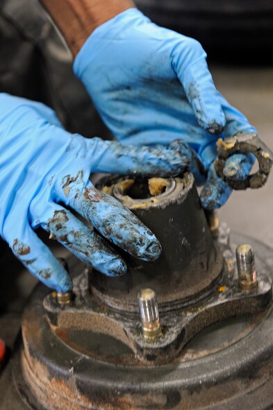 ELLSWORTH AIR FORCE BASE, S.D. - Airman 1st Class Kymric Walker, 28th Maintenance Squadron aerospace propulsion apprentice, performs routine maintenance to a B-1B Lancer engine trailer by lubricating its wheel bearings, April 9.  The engine trailers require routine maintenance to properly transport B-1 engines. (U.S. Air Force photo/Senior Airman Marc I. Lane)
