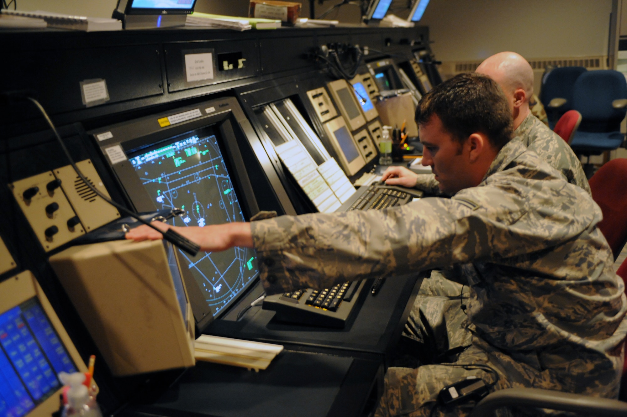WHITEMAN AIR FORCE BASE, Mo. - Staff Sgt. Ryan Tripp, 509th Operations Support Squadron air traffic controller, coordinates with the air route traffic control center as an aircraft climbs out of Whiteman's airspace. The ARTCC controls the airspace above Whiteman's AOR. (U.S. Air Force photo/Staff Sgt. Jason Huddleston)

