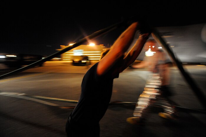 Douglas Alexandria services the water hose lines so fire trucks are back in service for future requirements April 12, 2010, at Joint Base Charleston, S.C. Mr. Alexandria is a lead firefighter with the 628th Civil Engineer Squadron. (U.S. Air Force photo by James M. Bowman/released)