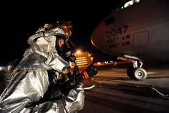 Tech Sgt. Todd Barnett maintains the back up water line for a rapid intervention team during C-17 egress training April 12, 2010, at Joint Base Charleston, S.C. Sergeant Barnett's primary responsibility is to help the attack team if trouble should arise inside the C-17. Sergeant Barnett is a crew chief with the 628th Civil Engineer Squadron. (U.S. Air Force photo by James M. Bowman/released)