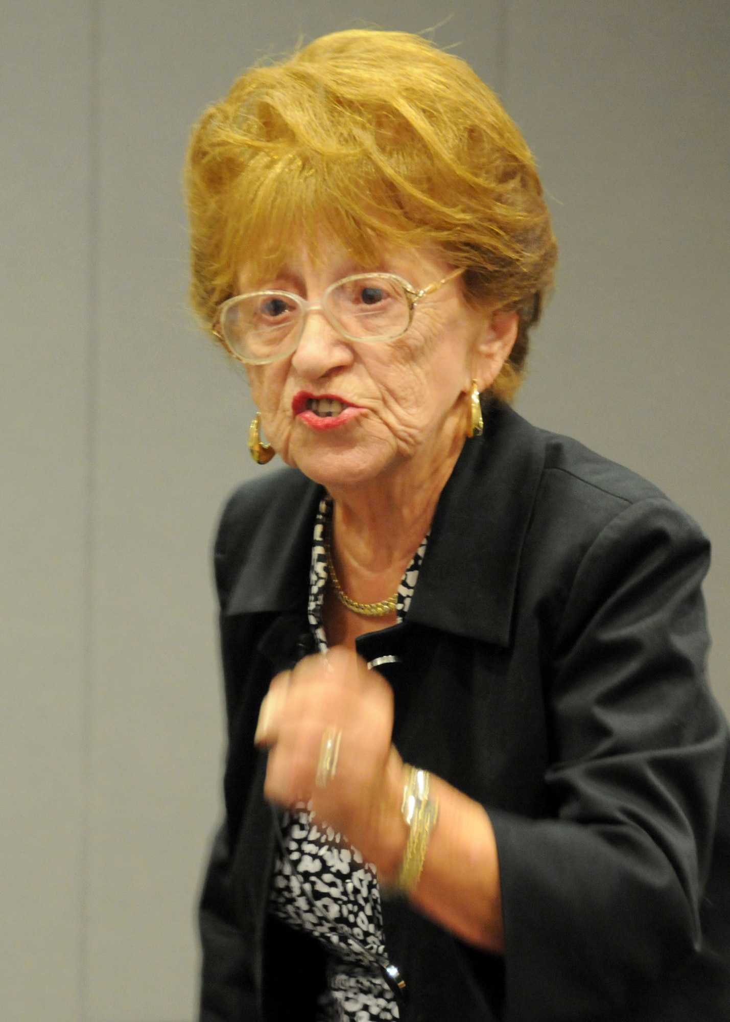 Holocaust survivor Regina Hirsch speaks with conviction as she recounts her experience to the group gathered to listen to her talk during the Space and Missile Systems Center Holocaust Memorial Observance, April 12. Ms Hirsch endured beatings and hunger and witness torture and murder of Jews, including her own family, during the Holocaust. (Photo by Joe Juarez)