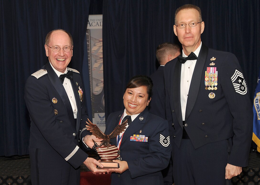 Tech. Sgt. Nancy Connell (center), 61 MDOS, is selected as the 2009 Air Force Space Command’s Outstanding Non-Commissioned Officer during the AFSPC Outstanding Airmen of the Year competition at Peterson Air Force Base, Colo., April 9. Gen. C. Robert Kehler (left), AFSPC commander, and Chief Master Sergeant Todd Small presented the award.  Tech. Sgt. Connell will now advance to compete against MAJCOMS winners for the AF Outstanding Airmen of the Year. Other members representing SMC at the AFSPC level competition in other categories were: CGO – Capt. Nicholas Feranec, GPSW; First Shirt – Master Sgt. Tom Martin, 61 MSG; SNCO – Senior Master Sgt. Tony Frazier, 61 SFS; and Airman – Staff Sgt. Veronica Ahumada, 61 MDOS. (Photo by Tech. Sgt, Matthew Lohr, AFSPC/PAC)
