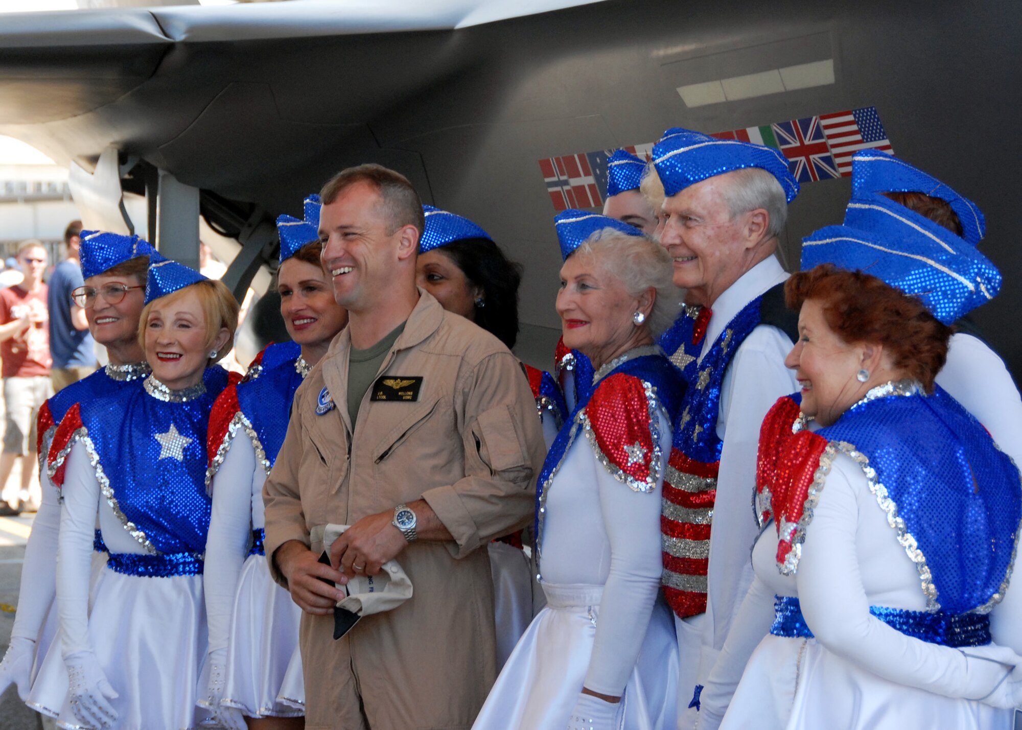 The "Highsteppers" dance group pose with Lt. Col. James Wellons, Marine Fighter Attack Training Squadron 501, at the F-35 display April 11 at the Eglin 75th Anniversary Air Show. More than 125,000 were in attendance for the show April 10-11, enjoying a variety of aerial performances and static displays. This was Eglin’s first open house since 2007 and was timed to coincide with the 75th anniversary of the installation. The Thunderbirds, Army Black Daggers, an F-22A Raptor demo and "Tora, Tora, Tora" were some of the highlights of the event. (U.S. Air Force photo/Samuel King Jr.) 