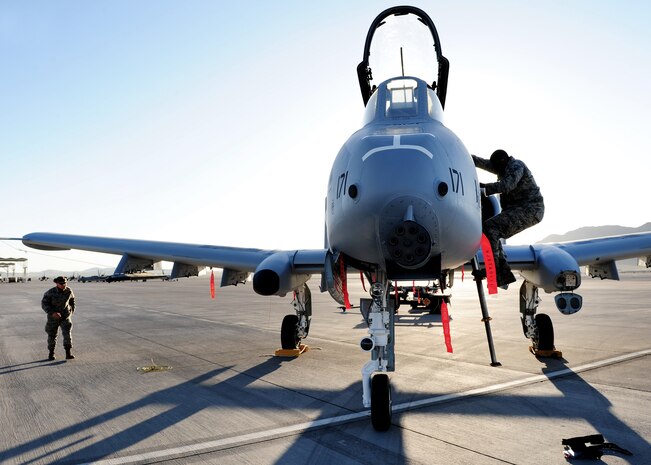 NELLIS AIR FORCE BASE, Nev. -- Staff Sgt. Cir Thomas, 757th Aircraft Maintenance Squadron load crew memeber, steps down from the canopy of an A-10 Thunderbolt during a load crew competition, April 9, 2010.  (U.S. Air Force Photo by Staff Sgt. William P. Coleman)
