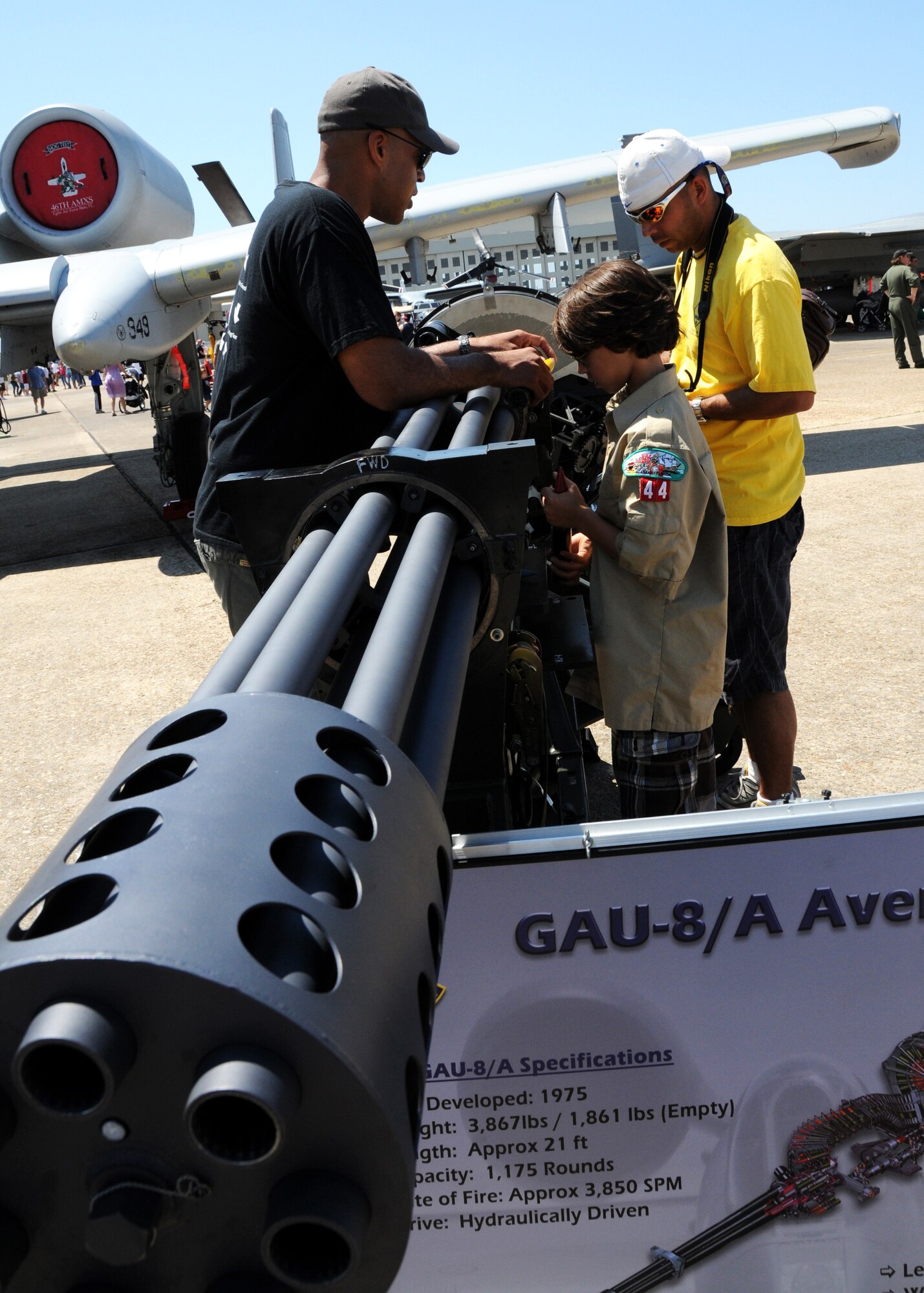 Airshow patrons check out the A-10's GAU-8 cannon April 11 for the Eglin 75th Anniversary Air Show. More than 125,000 were in attendance for the show April 10-11, enjoying a variety of aerial performances and static displays. This was Eglin’s first open house since 2007 and was timed to coincide with the 75th anniversary of the installation. The Thunderbirds, Army Black Daggers, an F-22A Raptor demo and "Tora, Tora, Tora" were some of the highlights of the event. (U.S. Air Force photo/Samuel King Jr.) 