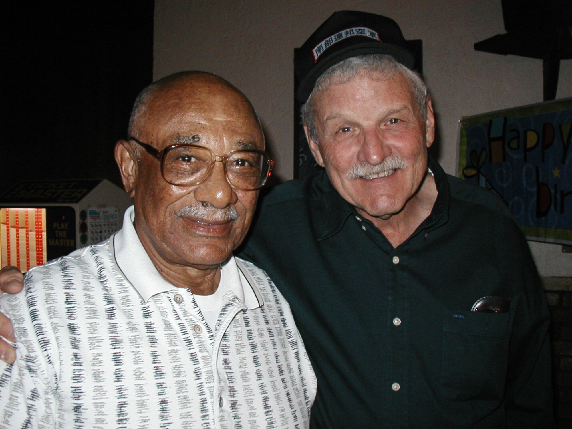 Retired Lt. Col. Harrison "Harry" Tull (left) and retired Brig. Gen. Regis F.A. Urschler pose for a photograph about five years ago. The two officers served together with the 55th Strategic Reconnaissance Wing at Offutt Air Force Base, Neb., in 1956. A new road on Offutt was named in honor of Colonel Tull, a member of the famed Tuskegee Airmen, during a ceremony April 6, 2010. (Courtesy photo) 