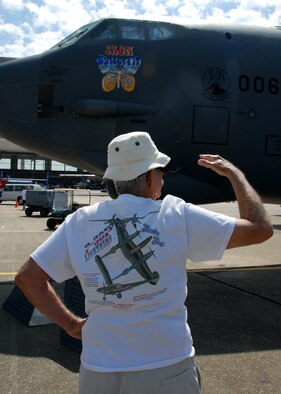 A patron tries to decide what to see next April 11 at the Eglin 75th Anniversary Air Show. More than 125,000 were in attendance for the show April 10-11, enjoying a variety of aerial performances and static displays. This was Eglin’s first open house since 2007 and was timed to coincide with the 75th anniversary of the installation. The Thunderbirds, Army Black Daggers, an F-22A Raptor demo and "Tora, Tora, Tora" were some of the highlights of the event. (U.S. Air Force photo/Airman 1st Class Anthony Jennings.) 