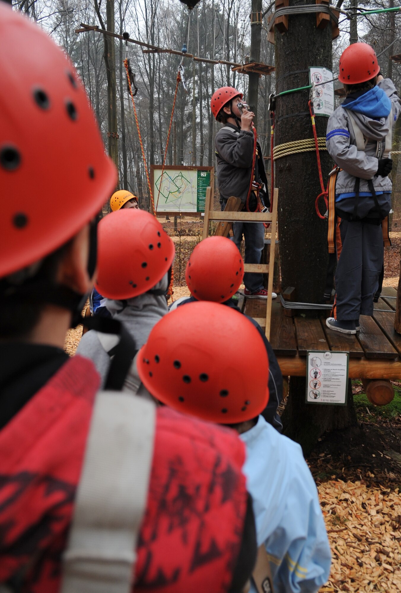 Children attending the Vogelweh Spring Break Outdoor Adventure Camp at K1 High Ropes Course Fröhnerhof, show off their skills by completing obstacles throughout the course, Kaiserslautern, Germany, April 13, 2010.  Vogelweh Youth Center hosted the Vogelweh Spring Break Camps during a weeklong series of events for children ages 9-12 in the Kaiserslautern Military Community, consisting of Sports, Outdoor Adventure, The Arts, and Swimming Camps ending off with a movie day. (U.S. Air Force Photo by Airman 1st Class Caleb Pierce)