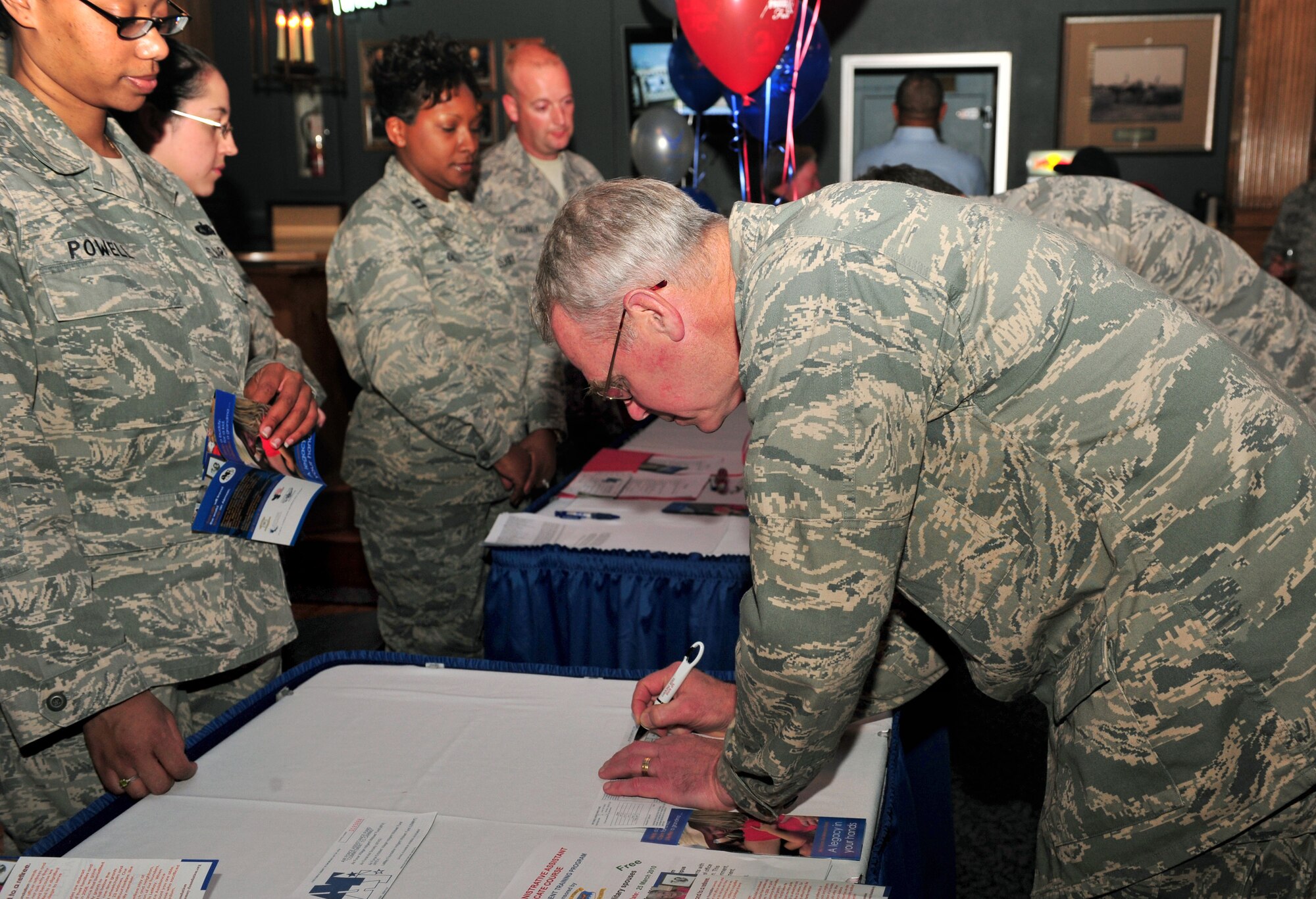 100309-F-8430J-253
SHAW AIR FORCE BASE, S.C. - Maj. Gen. William Holland, Ninth Air Force commander donates to the Air Force Assistance Fund at the Carolina Skies Club Mar. 9. After taking command of the Ninth Air Force Maj. Gen. Holland and Mrs. Holland take an official tour of the 20th Fighter Wing. (U.S. Air Force photo/Airman 1st Class Amber E. N. Jacobs)
