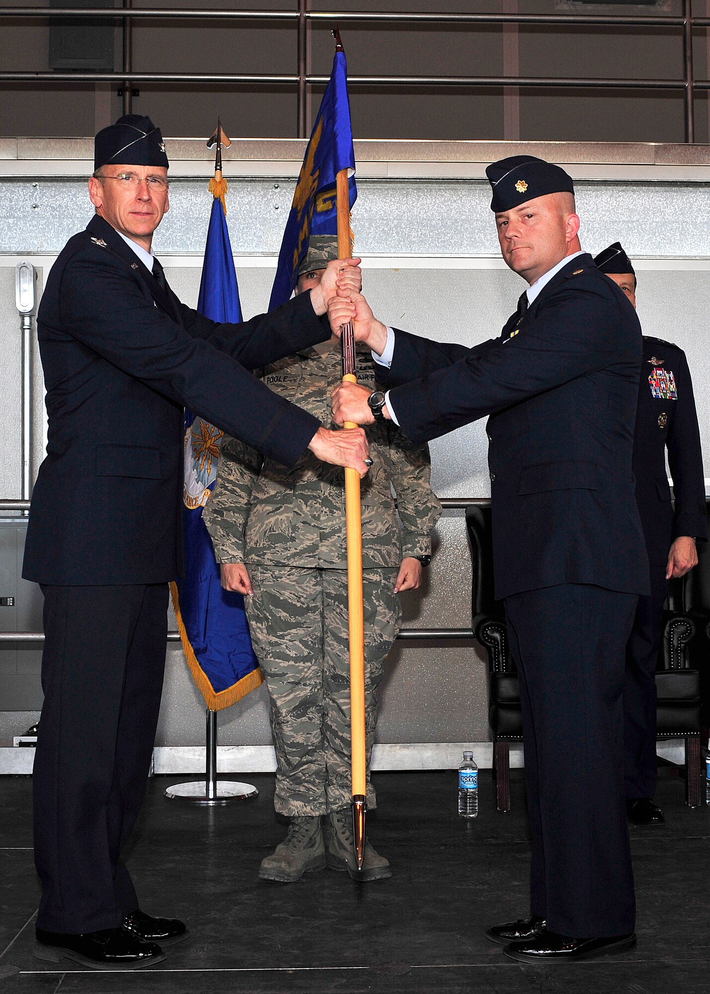 HOLLOMAN AIR FORCE BASE, N.M. -- Maj. William Magee assumes command of the 44th Aircraft Maintenance Squadron from Col. Donald Lindberg, 44th Fighter Group commander, during an activation ceremony in Hangar 877 April 9, 2010.  The 44th FG traces its lineage to the famed World War II 44th Bombardment Group (Heavy) originally activated in January 1941 at MacDill Army Air Field in Tampa Bay, Fla., and flew the then state-of-the-art B-17 Flying Fortress. Sixty-nine years later, the 44th FG is the only Air Force Reserve organization to be selected to fly the U.S. Air Force's premier air superiority fighter, the F-22 Raptor. (U.S. Air Force photo by Senior Airman DeAndre Curtiss / Released)