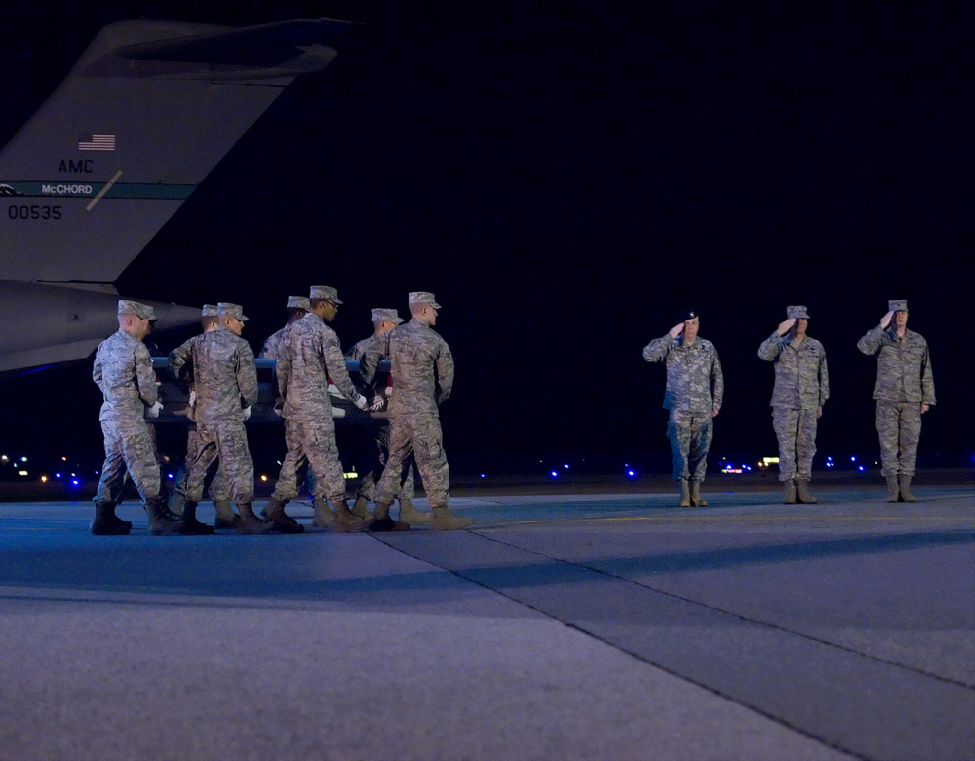 A U.S. Air Force carry team transfers the remains of Maj. Randell  D. Voas at Dover Air Force Base, Del., on April 10, 2010. Major Voas died April 9 near Kandahar, Afghanistan, in a crash of a CV-22 Osprey. He was assigned to the 8th Special Operations Squadron, Hurlburt Field, Fla. (U.S. Air Force photo/Brianne Zimny)