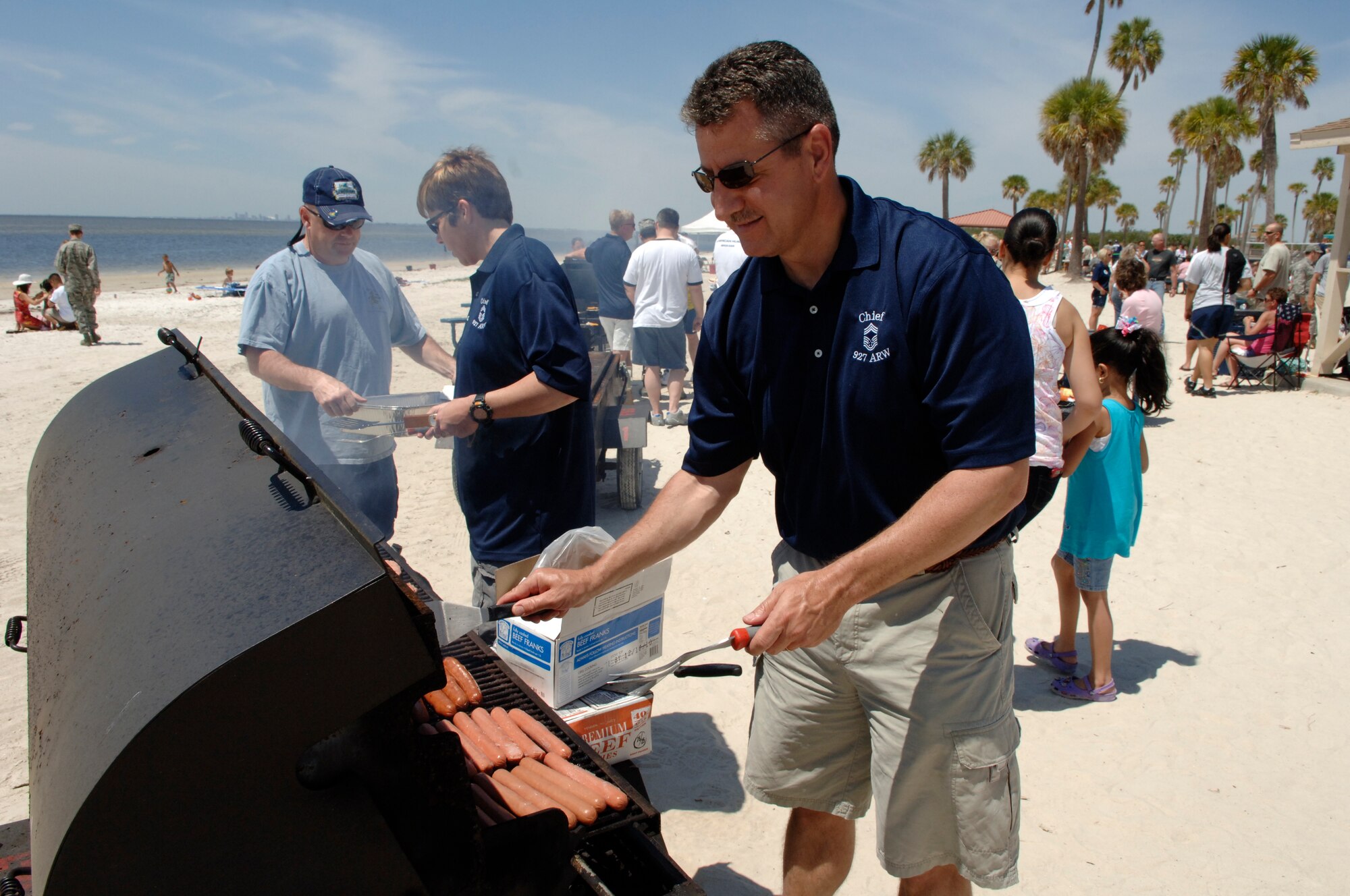 Chief Master Sergeant Bryan Lee cooks hotdogs during the family day picnic (U.S. Air Force photo by Capt. Shane Huff)