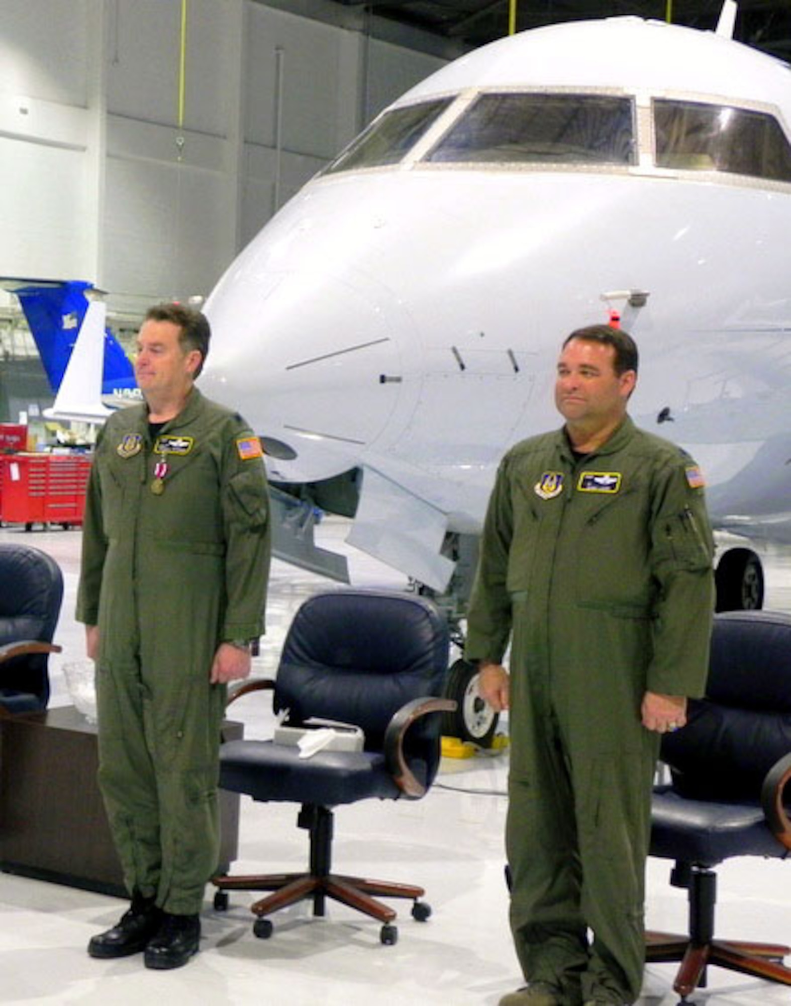 Maj. Robert F. “Bobby” Loher, right, became the commander of the 1st Aviation Standards Flight during a recent change of command ceremony. Major Loher spent the last 10 years teaching and training for the T-1A Program at Randolph AFB, Texas. Outgoing commander, Lt. Col. Randall Peterson, is on the left.  Peterson had been commander of the 1st ASF since 1998 and was the first commander for the Flight.