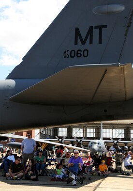 Attendees seek shade underneath the tail of a B-52 Statofortress at the 75th Anniversary Air Show April 11. More than 125,000 were in attendance during the air show April 10-11, enjoying a variety of aerial performances and static displays. This was Eglin’s first open house since 2007 and was timed to coincide with the 75th anniversary of the installation. The F-22A Raptor demo, Army Black Daggers and "Tora, Tora, Tora" were some of the highlights of the event. (U.S. Air Force photo/ Samuel King Jr.)