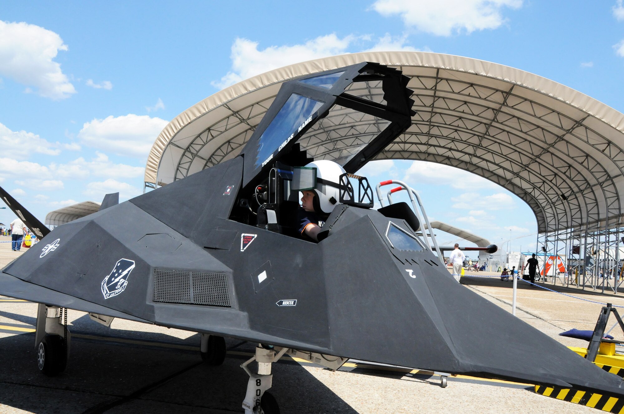 A future-pilot checks his three-o'clock during 75th Anniversary Air Show April 11. More than 125,000 were in attendance during the air show April 10-11, enjoying a variety of aerial performances and static displays. This was Eglin’s first open house since 2007 and was timed to coincide with the 75th anniversary of the installation. The F-22A Raptor demo, Army Black Daggers and "Tora, Tora, Tora" were some of the highlights of the event. (U.S. Air Force photo/ Samuel King Jr.)