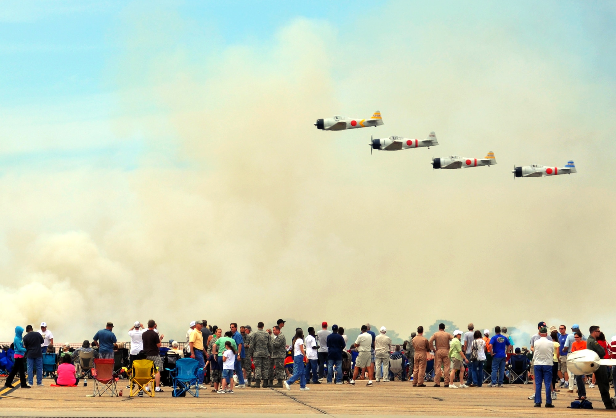 EGLIN AIR FORCE BASE, Fla. --  A group of T-6 Texans rebuilt as Japanese Zeros re-enact the bombing of Pearl Harbor in 1941 in the "Tora, Tora, Tora" show during the 75th Anniversary Air Show April 10. More than 125,000 were in attendance during the air show April 10-11, enjoying a variety of aerial performances and static displays. This was Eglin’s first open house since 2007 and was timed to coincide with the 75th anniversary of the installation. The Thunderbirds, Army Black Daggers and an F-22A Raptor demo were some of the highlights of the event. (U.S. Air Force photo/ Airman 1st Class Veronica McMahon)