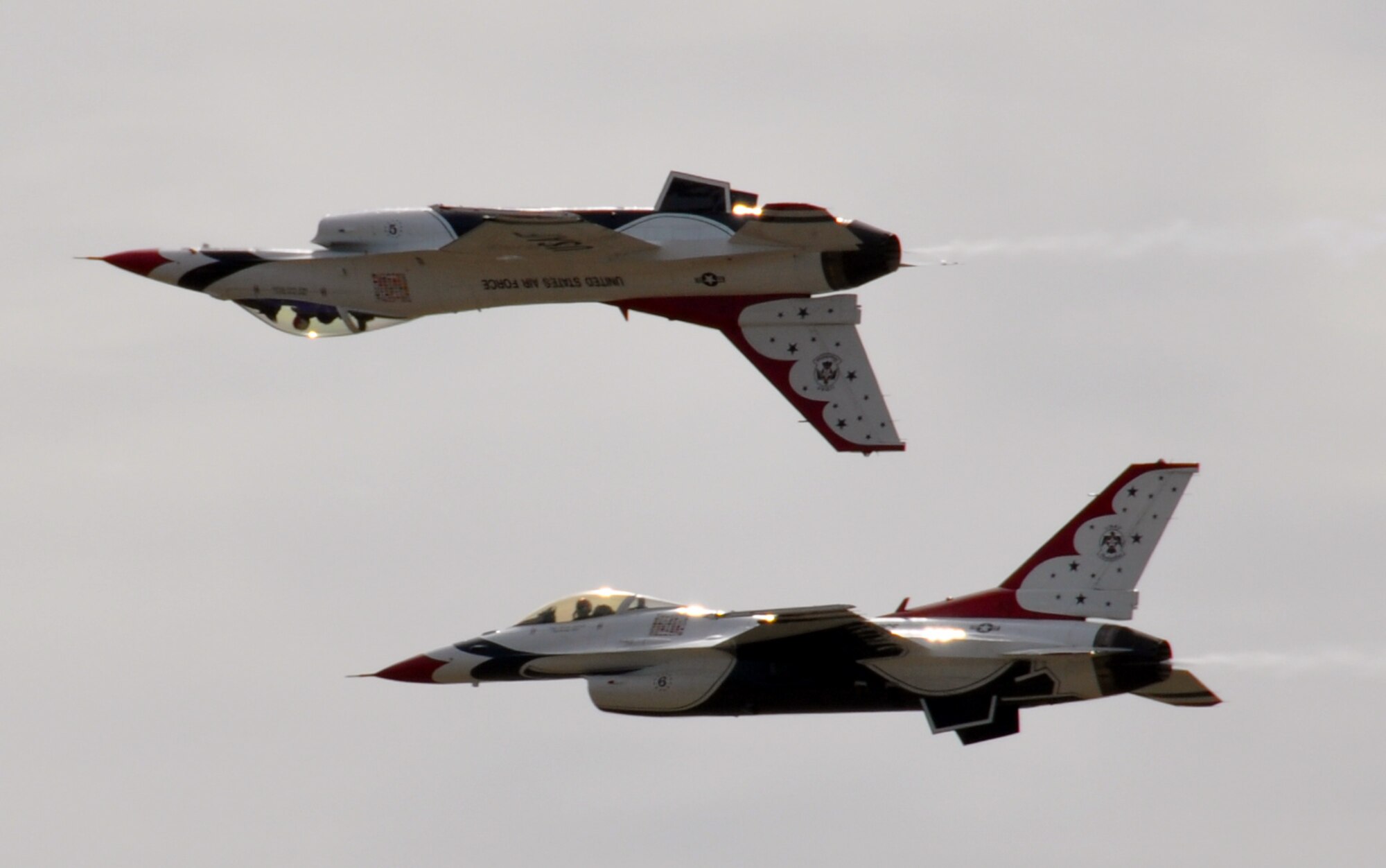 EGLIN AIR FORCE BASE, Fla. – The U.S Air Force Thunderbirds demonstrate the capabilities of the F-16 Fighting Falcon by performing acrobatic maneuvers during the 75th Anniversary Air Show April 10. More than 125,000 were in attendance during the air show April 10-11, enjoying a variety of aerial performances and static displays. This was Eglin’s first open house since 2007 and was timed to coincide with the 75th anniversary of the installation. The F-22A Raptor demo, Army Black Daggers and "Tora, Tora, Tora" were some of the highlights of the event. (U.S. Air Force photo/ Airman 1st Class Rachel Elsea)