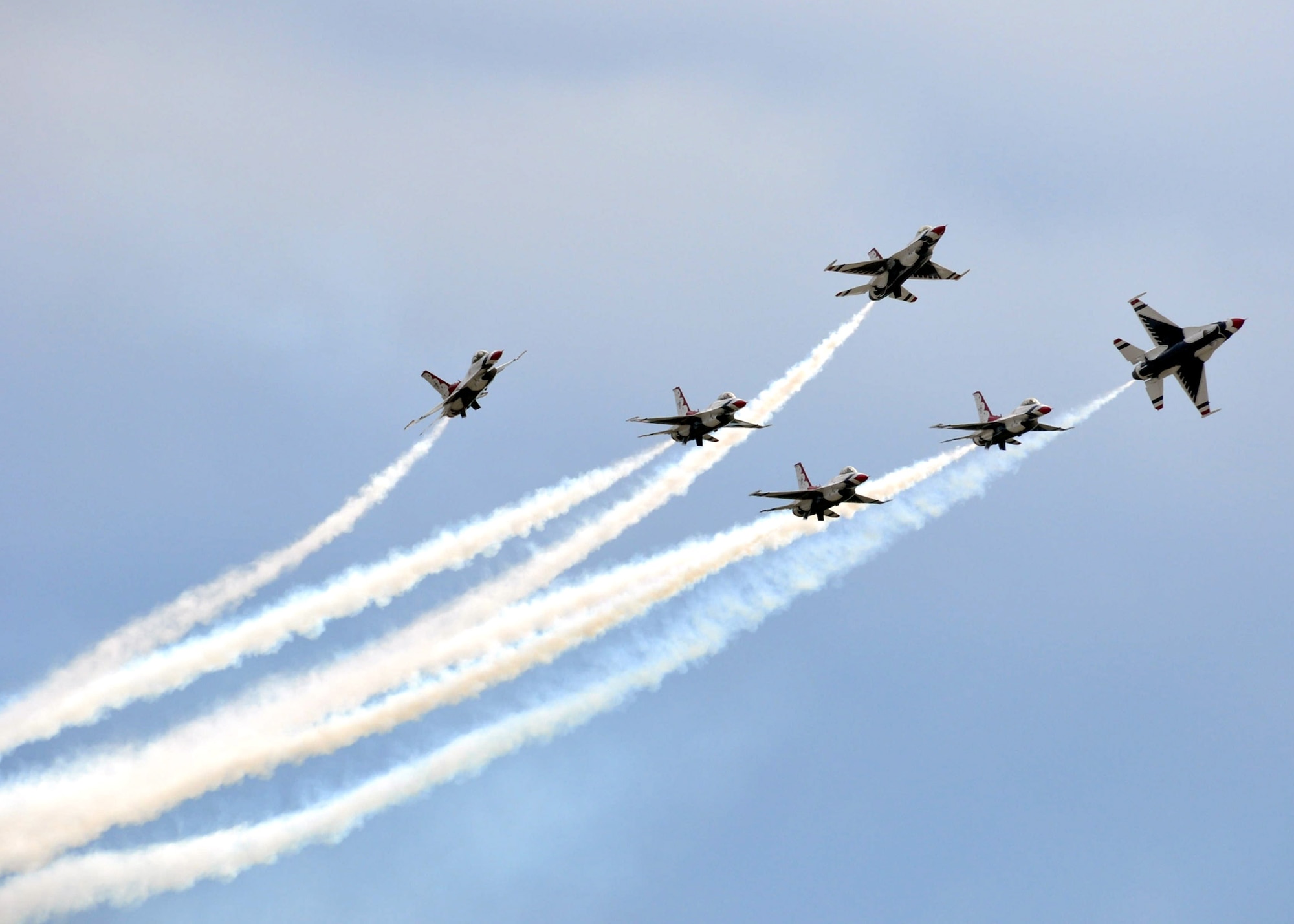 EGLIN AIR FORCE BASE, Fla. – The U.S Air Force Thunderbirds demonstrate the capabilities of the F-16 Fighting Falcon by performing acrobatic maneuvers during the 75th Anniversary Air Show April 10. More than 125,000 were in attendance during the air show April 10-11, enjoying a variety of aerial performances and static displays. This was Eglin’s first open house since 2007 and was timed to coincide with the 75th anniversary of the installation. The F-22A Raptor demo, Army Black Daggers and "Tora, Tora, Tora" were some of the highlights of the event. (U.S. Air Force photo/ Airman 1st Class Rachel Elsea)