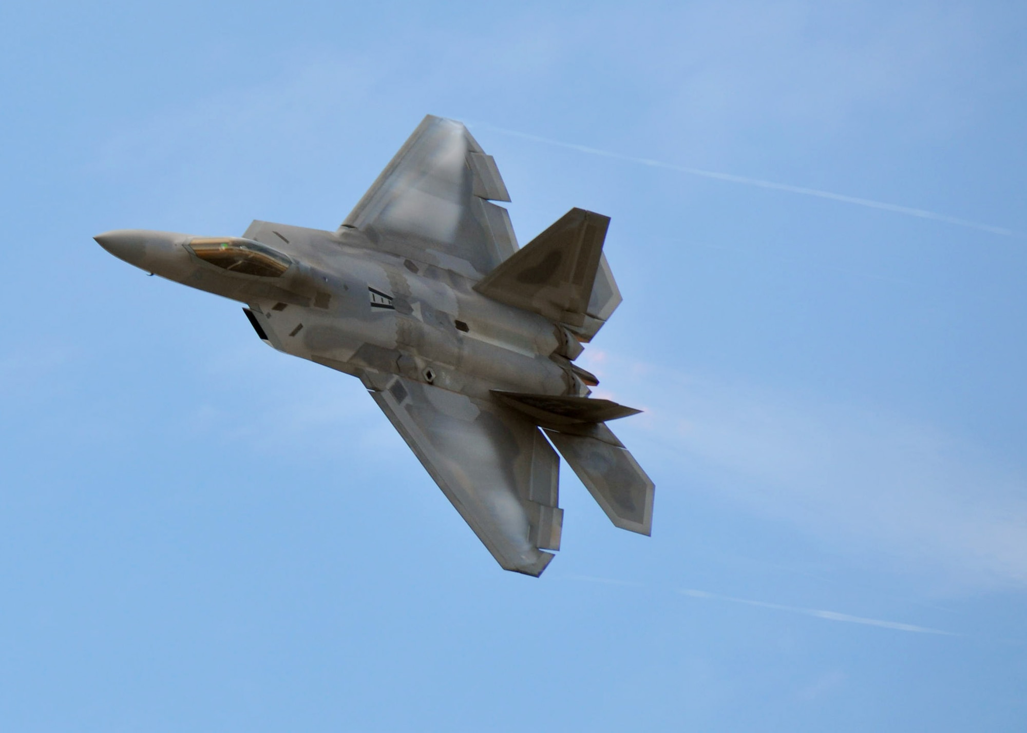 EGLIN AIR FORCE BASE, Fla. – An F-22A Raptor performs a flyby during the 75th Anniversary Air Show April 10. More than 125,000 were in attendance during the air show April 10-11, enjoying a variety of aerial performances and static displays. This was Eglin’s first open house since 2007 and was timed to coincide with the 75th anniversary of the installation. The Thunderbirds, Army Black Daggers and "Tora, Tora, Tora" were some of the highlights of the event. (U.S. Air Force photo/ Airman 1st Class Rachel Elsea)