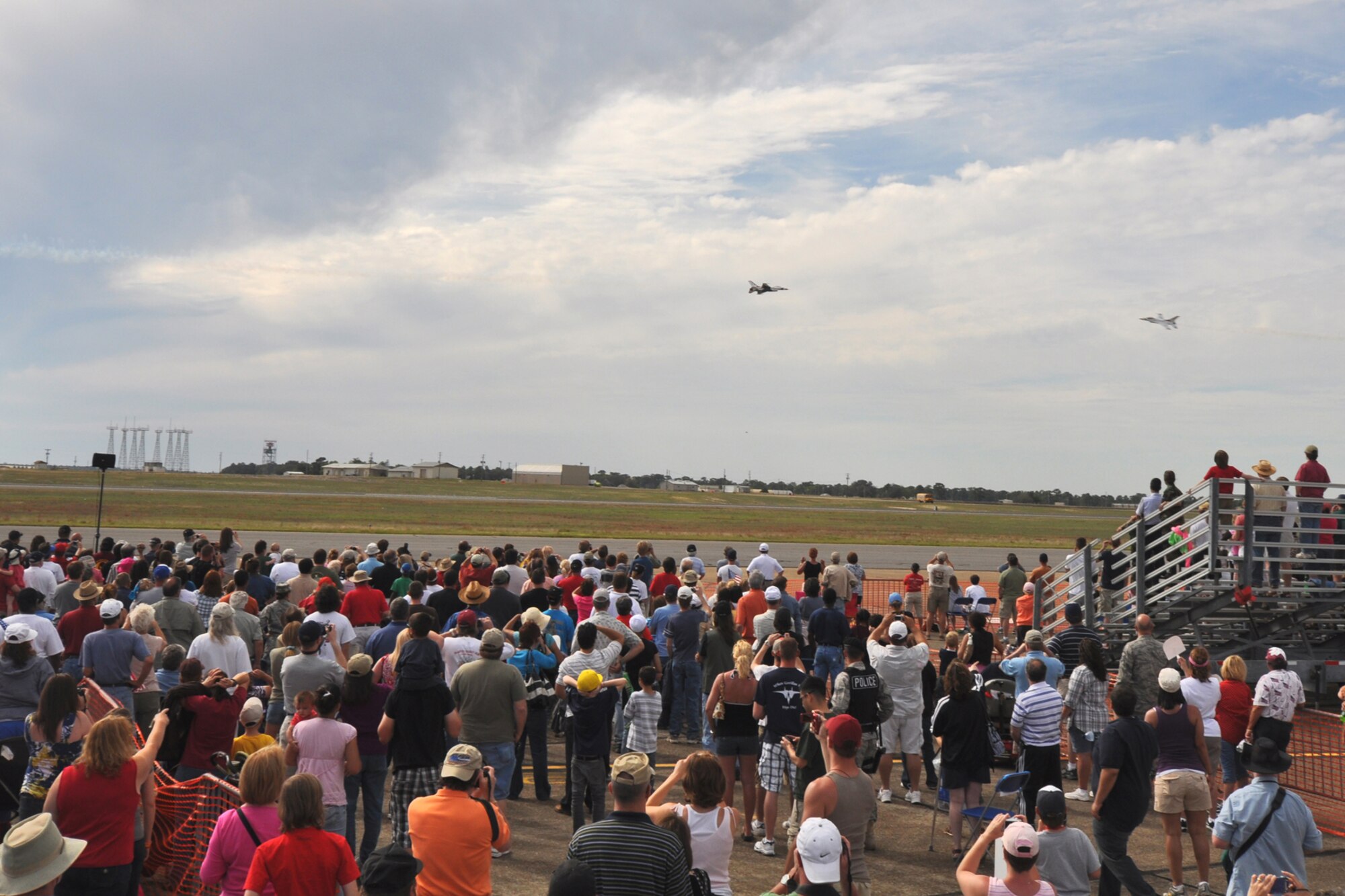 Spectators watch as two Thunderbird F-16s go nose-to-nose April 10 at the Eglin 75th Anniversary Air Show. More than 125,000 were in attendance for the show April 10-11, enjoying a variety of aerial performances and static displays. This was Eglin’s first open house since 2007 and was timed to coincide with the 75th anniversary of the installation. The Thunderbirds, Army Black Daggers, an F-22A Raptor demo and "Tora, Tora, Tora" were some of the highlights of the event. (U.S. Air Force photo/Airman 1st Class Anthony Jennings.) 
 
