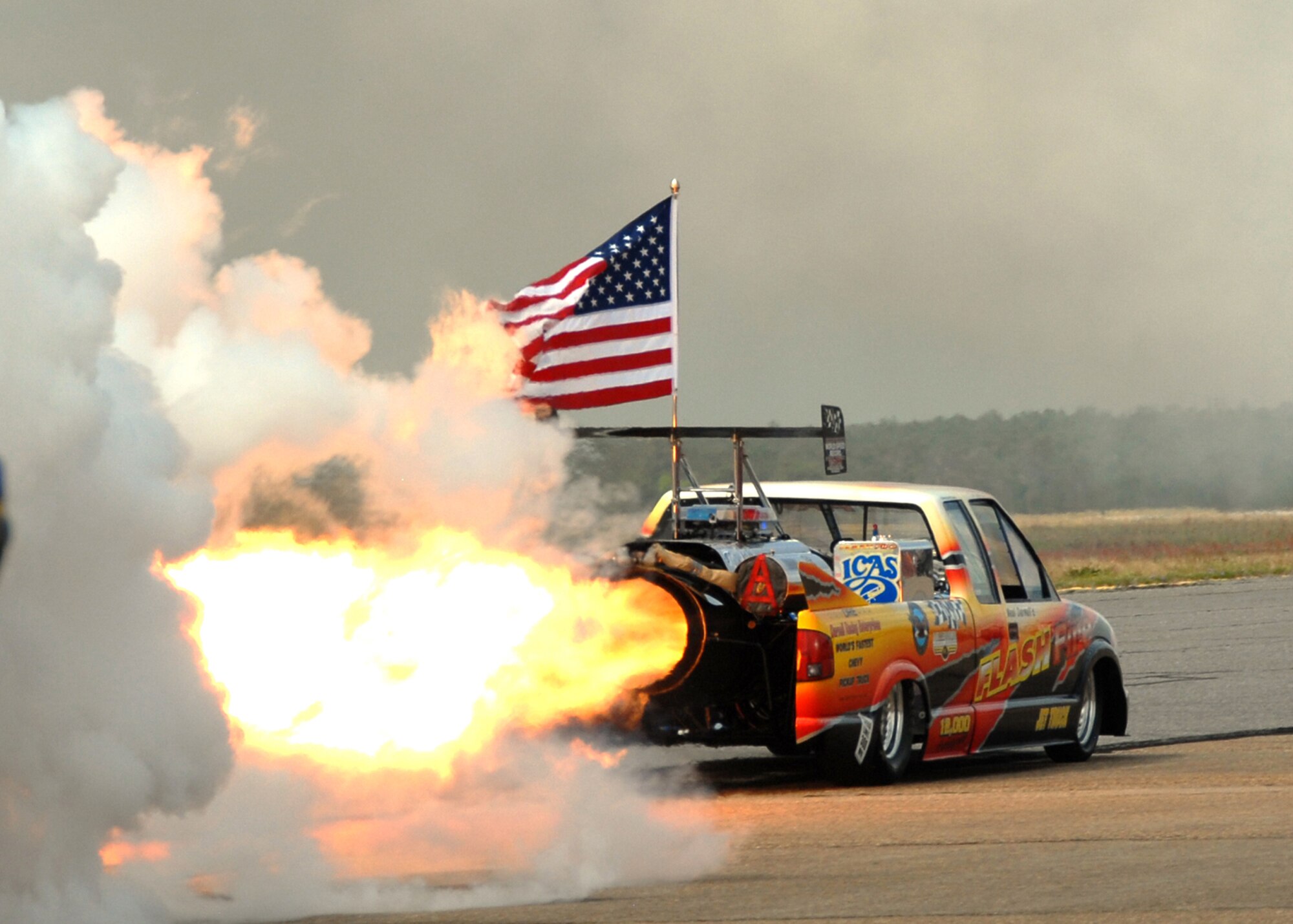 The Flashfire jet truck "takes off" April 10 at the Eglin 75th Anniversary Air Show. More than 125,000 were in attendance for the show April 10-11, enjoying a variety of aerial performances and static displays. This was Eglin’s first open house since 2007 and was timed to coincide with the 75th anniversary of the installation. The Thunderbirds, Army Black Daggers, an F-22A Raptor demo and "Tora, Tora, Tora" were some of the highlights of the event. (U.S. Air Force photo/Airman 1st Class Anthony Jennings.)