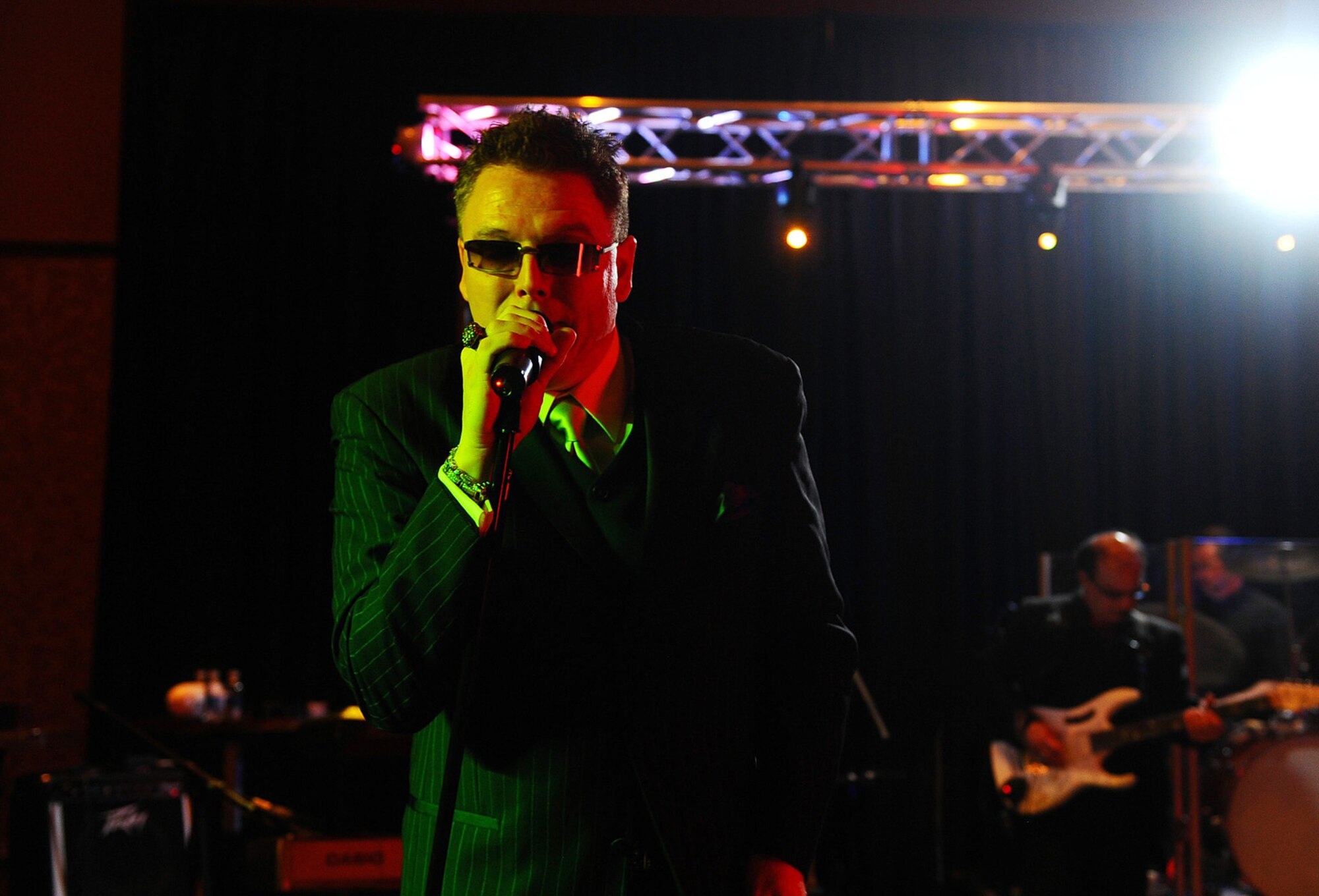 OFFUTT AIR FORCE BASE, Neb. -- Master Sgt. Donald J. Reynolds, Offutt's career assistance advisor and a singer with the The Doc James Band, entertains a crowd of more than 800 people during the 55th Wing Birthday Ball at Embassy Suites in La Vista April 10. The annual celebration honored the wing?s past and celebrated the current role of the Fightin? Fifty-Fifth in today?s Air Force. U.S. Air Force photo by Josh Plueger
