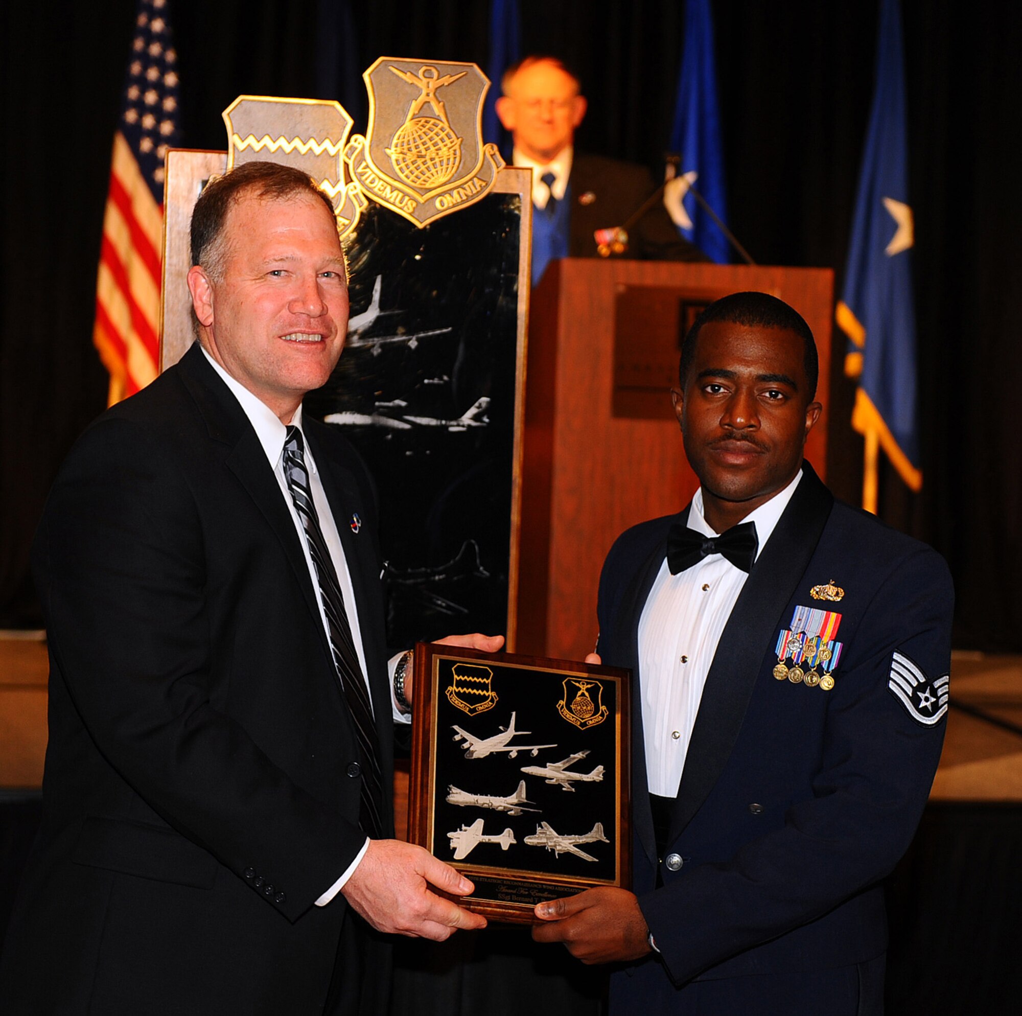 OFFUTT AIR FORCE BASE, Neb. ? Retired Col. Jim Thomas, president of the 55th Strategic Reconnaissance Wing Association, presents Staff Sgt. Bernard Beyer Jr., a network administrator with the 390th Intelligence Squadron, with the 55th Wing Association Award for Excellence at the 2010 55th Wing Birthday Ball at Embassy Suites in La Vista, Neb., April 10. The award is presented to a member of the 55th Wing who best exemplifies the basic tenets of the 55th Wing Association. Sergeant Byer also received the 55th Wing's 2009 Non-Commissioned Officer of the Year Award at the wing's annual awards banquet on Feb. 26. More than 800 members of Team Offutt attended the ball to honor the wing's past and celebrate the Fightin' Fifty-Fifth's current role in the Air Force. U.S. Air Force photo by Josh Plueger

