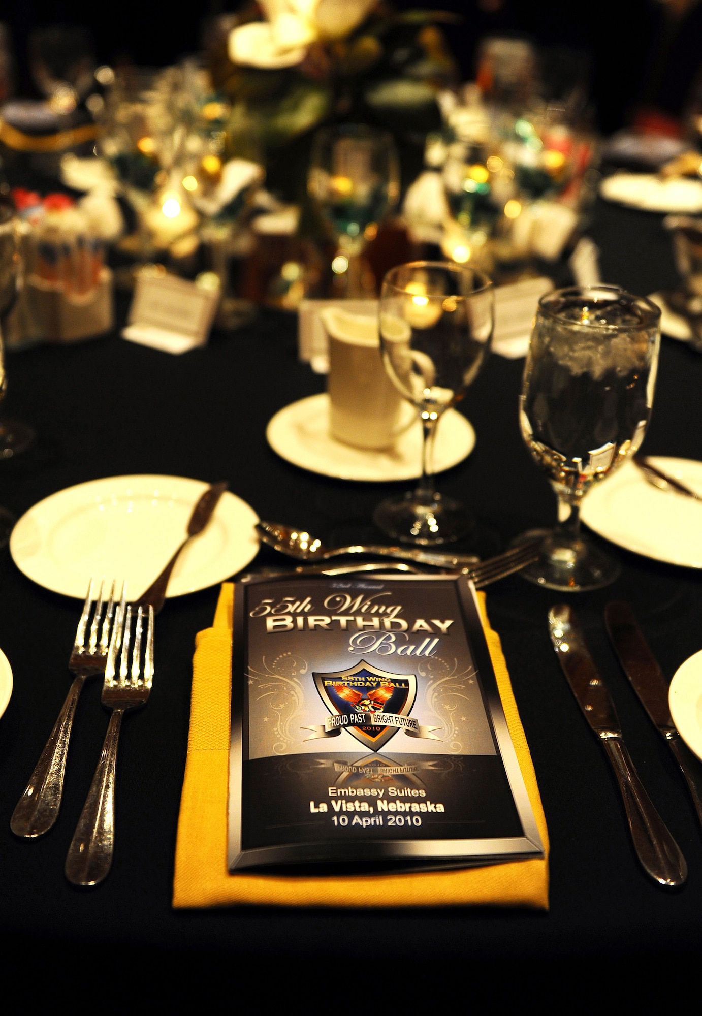 OFFUTT AIR FORCE BASE, Neb. ? A 2010 55th Wing Birthday Ball program, sits  at a table in the Embassy Suites Ballroom in La Vista, Neb., April 10 in preparation for the ceremony. The event, which was attended by more than 800 members of Team Offutt, is a formal celebration honoring the wing?s proud heritage, as well as its current mission and role in the Air Force. U.S. Air Force photo by Josh Plueger
