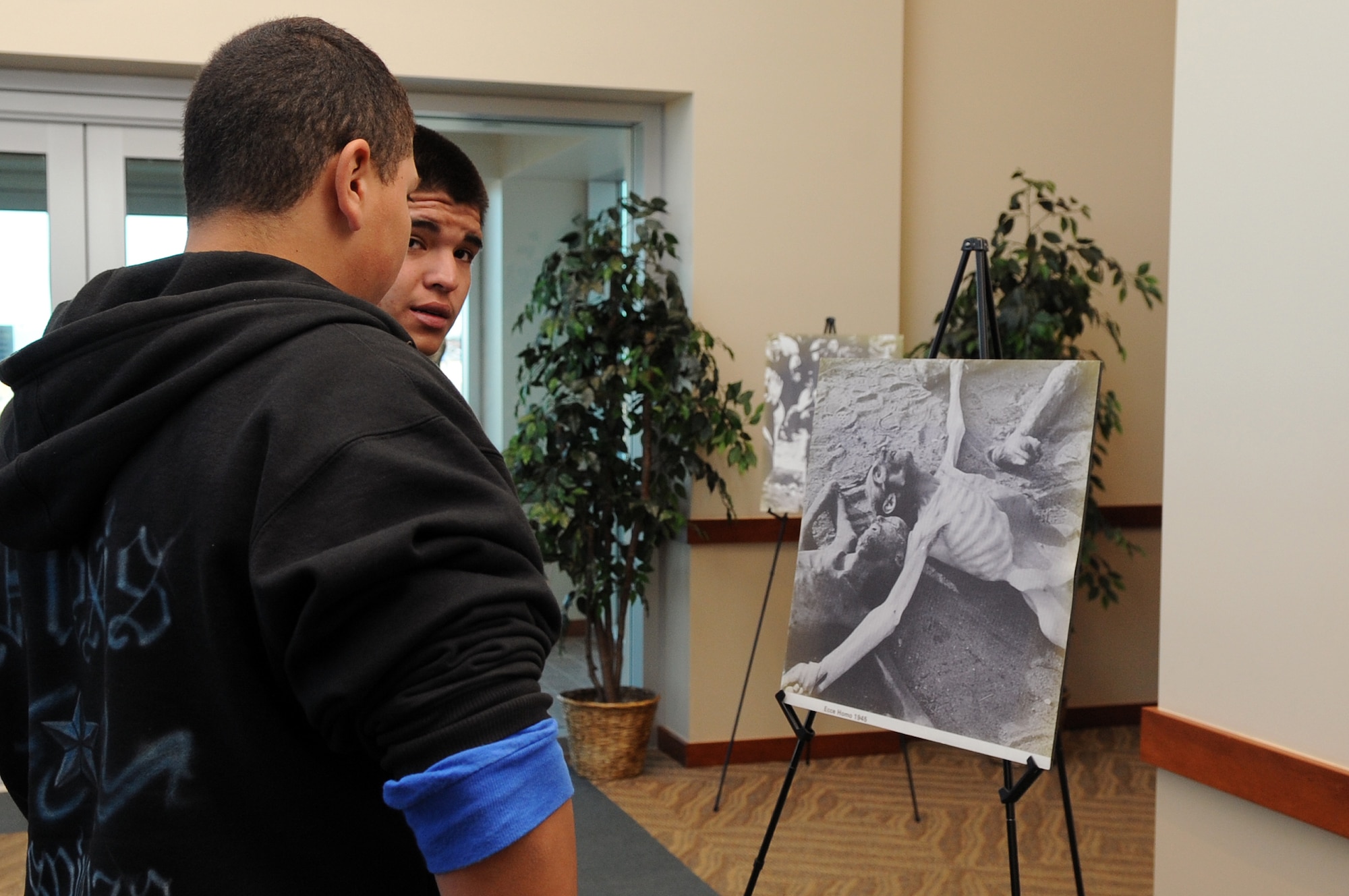 BUCKLEY AIR FORCE BASE, Colo. -- Hinkley High School students view photos of Holocaust victims April 9. Students from two local high schools were invited to the Days of Remembrance observance on Buckley. (U.S. Air Force Photo by Airman 1st Class Marcy Glass)

