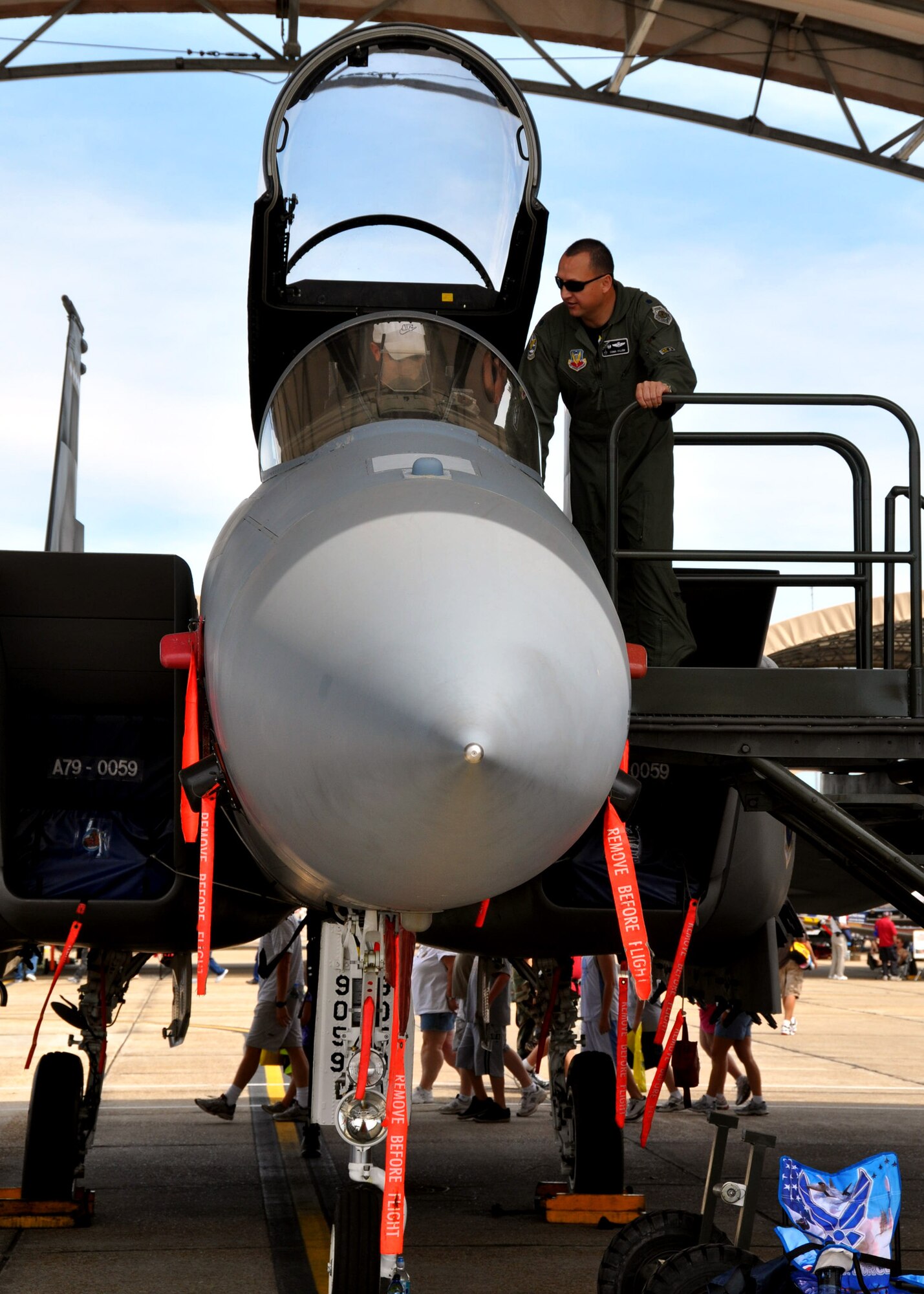 Lt. Col. Paul Villem, 85th Test and Evaluation Squadron commander, explains the functions of an F-15  to an airshow patron April 10 at the Eglin 75th Anniversary Air Show. More than 125,000 were in attendance for the show April 10-11, enjoying a variety of aerial performances and static displays. This was Eglin’s first open house since 2007 and was timed to coincide with the 75th anniversary of the installation. The Thunderbirds, Army Black Daggers, an F-22A Raptor demo and "Tora, Tora, Tora" were some of the highlights of the event. (U.S. Air Force photo/Airman 1st Class Rachelle Elsea.)