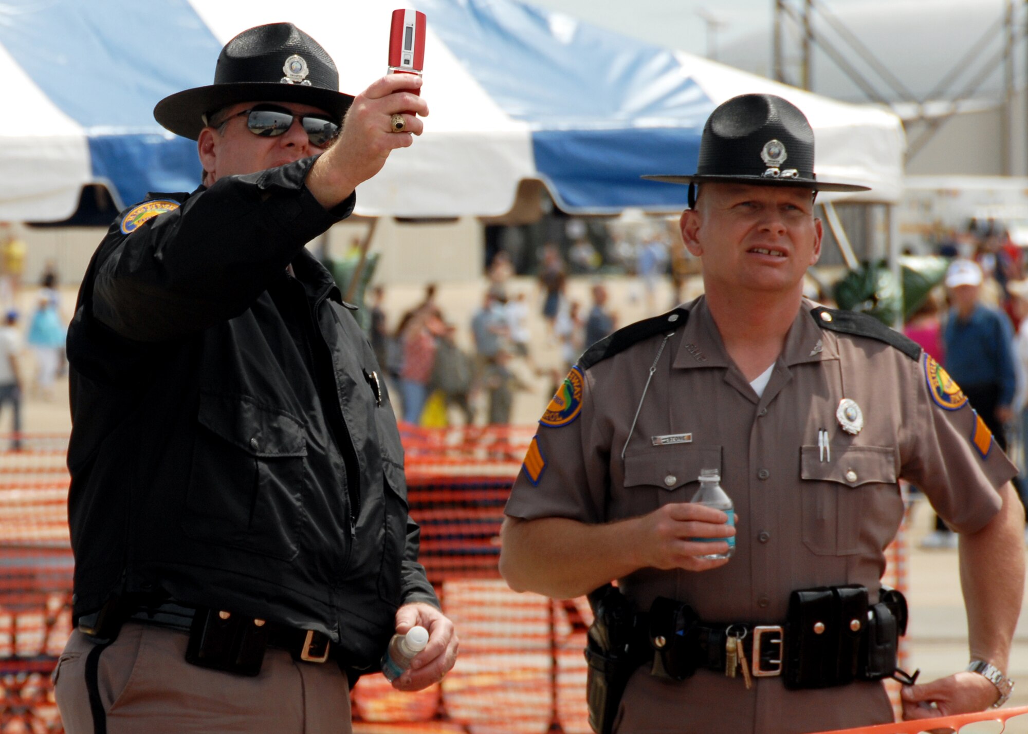 Florida-State Highway Patrolmen "verify the speed" of one of the flying acts April 10 at the Eglin 75th Anniversary Air Show. More than 125,000 were in attendance for the show April 10-11, enjoying a variety of aerial performances and static displays. This was Eglin’s first open house since 2007 and was timed to coincide with the 75th anniversary of the installation. The Thunderbirds, Army Black Daggers, an F-22A Raptor demo and "Tora, Tora, Tora" were some of the highlights of the event. (U.S. Air Force photo/Airman 1st Class Anthony Jennings.)