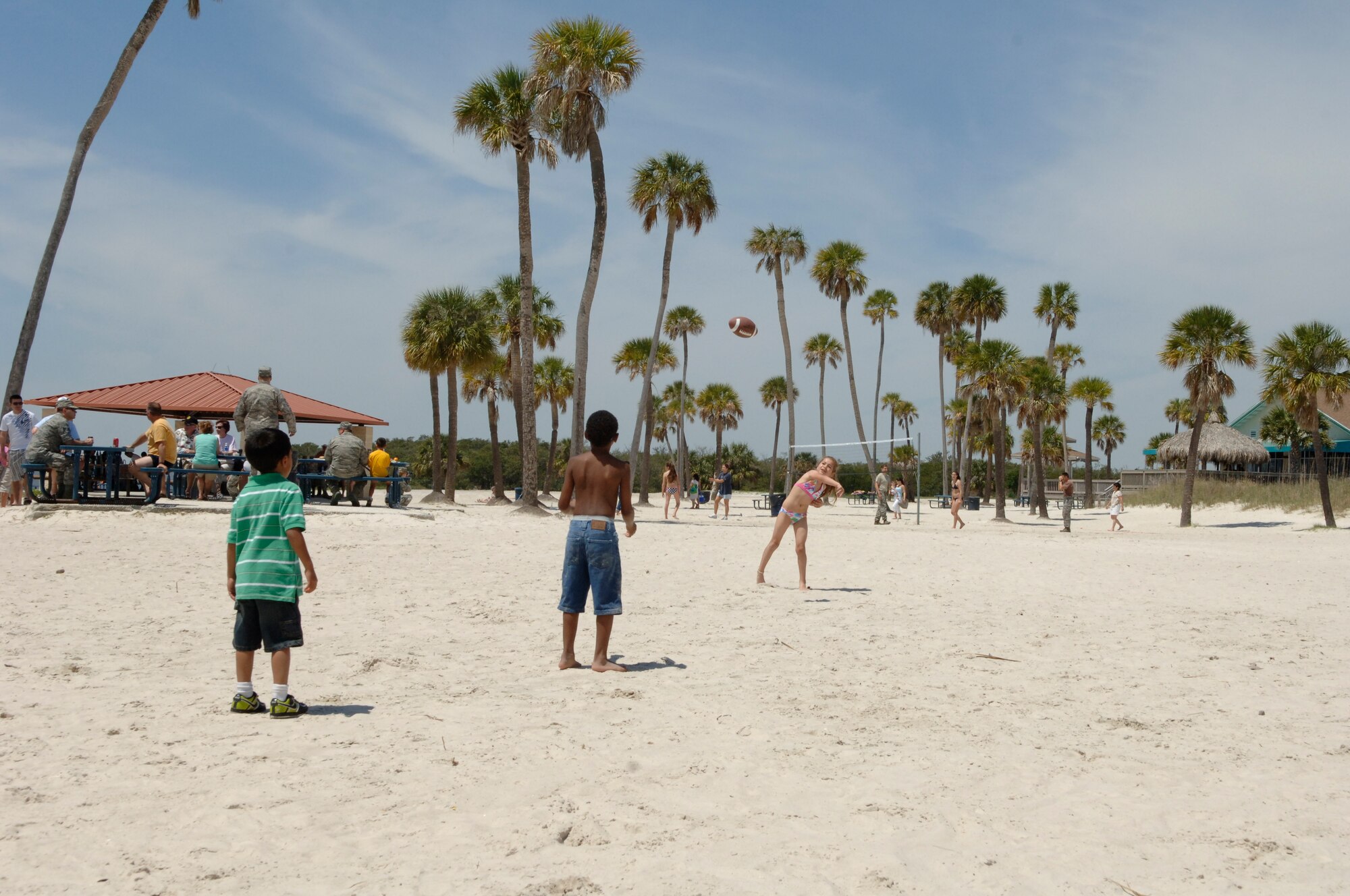 Some little football players enjoy throwing the ball on the beach at the 927th ARW Family Day Picnic (U.S. Air Force Photo by Capt. Shane Huff)
