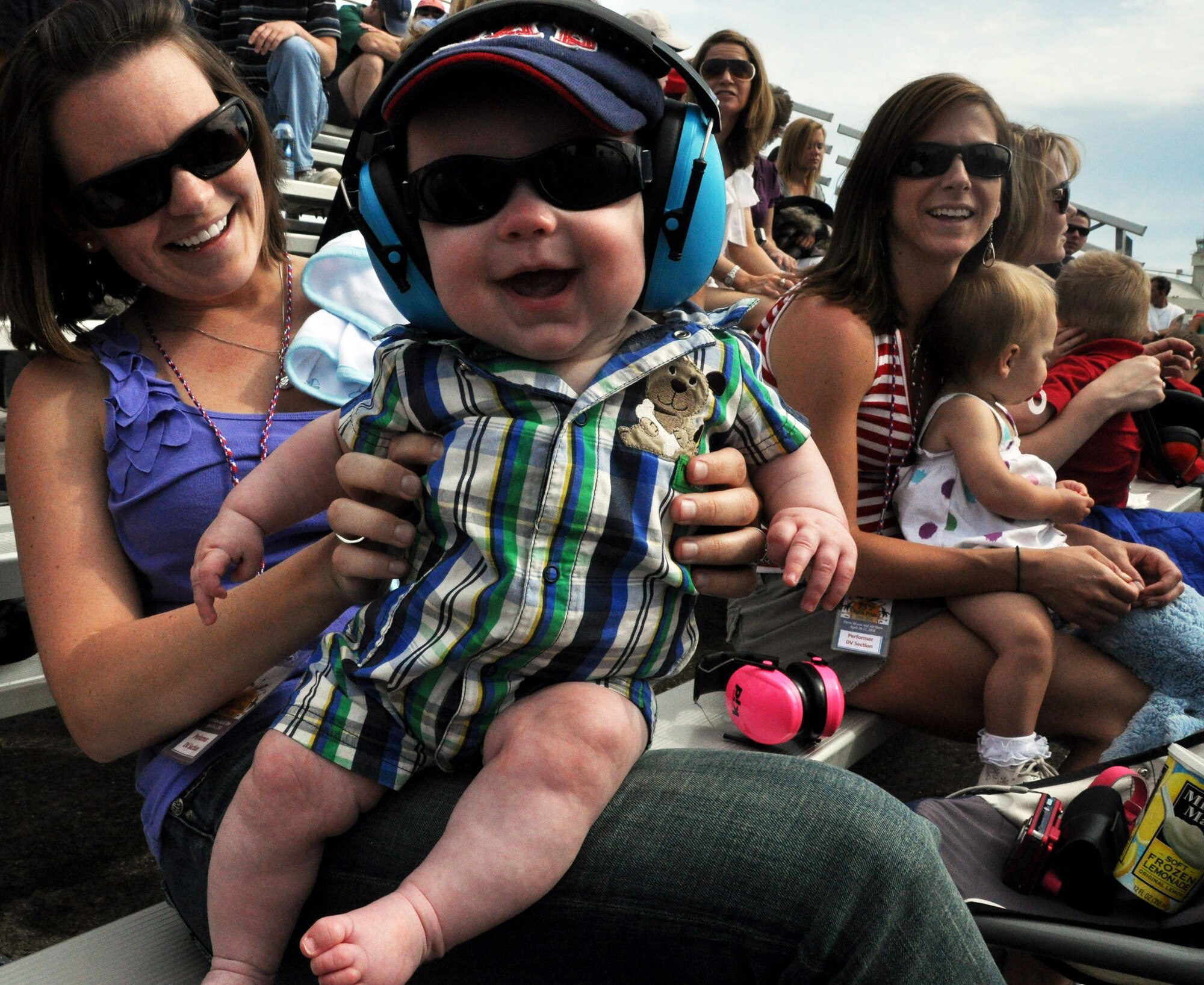 A baby and his mother enjoy the Eglin 75th Anniversary Air Show April 10.  More than 125,000 were in attendance at the airshow April 10-11, enjoying a variety of aerial performances and static displays. This was Eglin’s first open house since 2007 and was timed to coincide with the 75th anniversary of the installation. The Thunderbirds, Army Black Daggers, an F-22A Raptor demo and "Tora, Tora, Tora" were some of the highlights of the event. (U.S. Air Force photo/Airman 1st Class Rachelle Elsea.) 