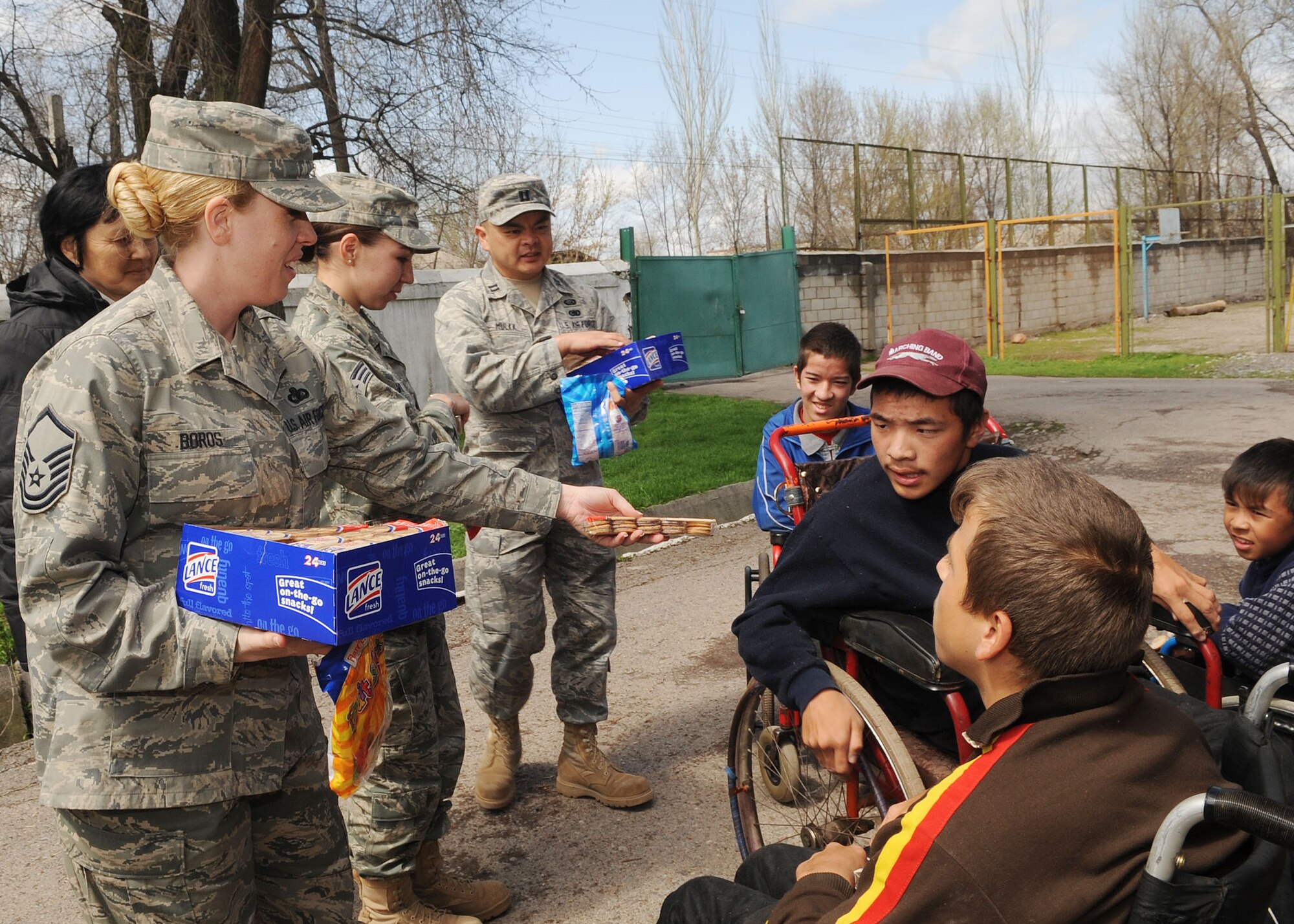 U.S. Airmen from the Transit Center at Manas, Kyrgyzstan, brought smiles to the faces of dozens of children during a visit to the Belovodsky Orphanage April 13, 2010. The trip was organized by humanitarian assistance director Lt. Col. Neal Linch and the Manas Area Benefit Outreach Society. (U.S. Air Force photo/Senior Airman Nichelle Anderson/released)